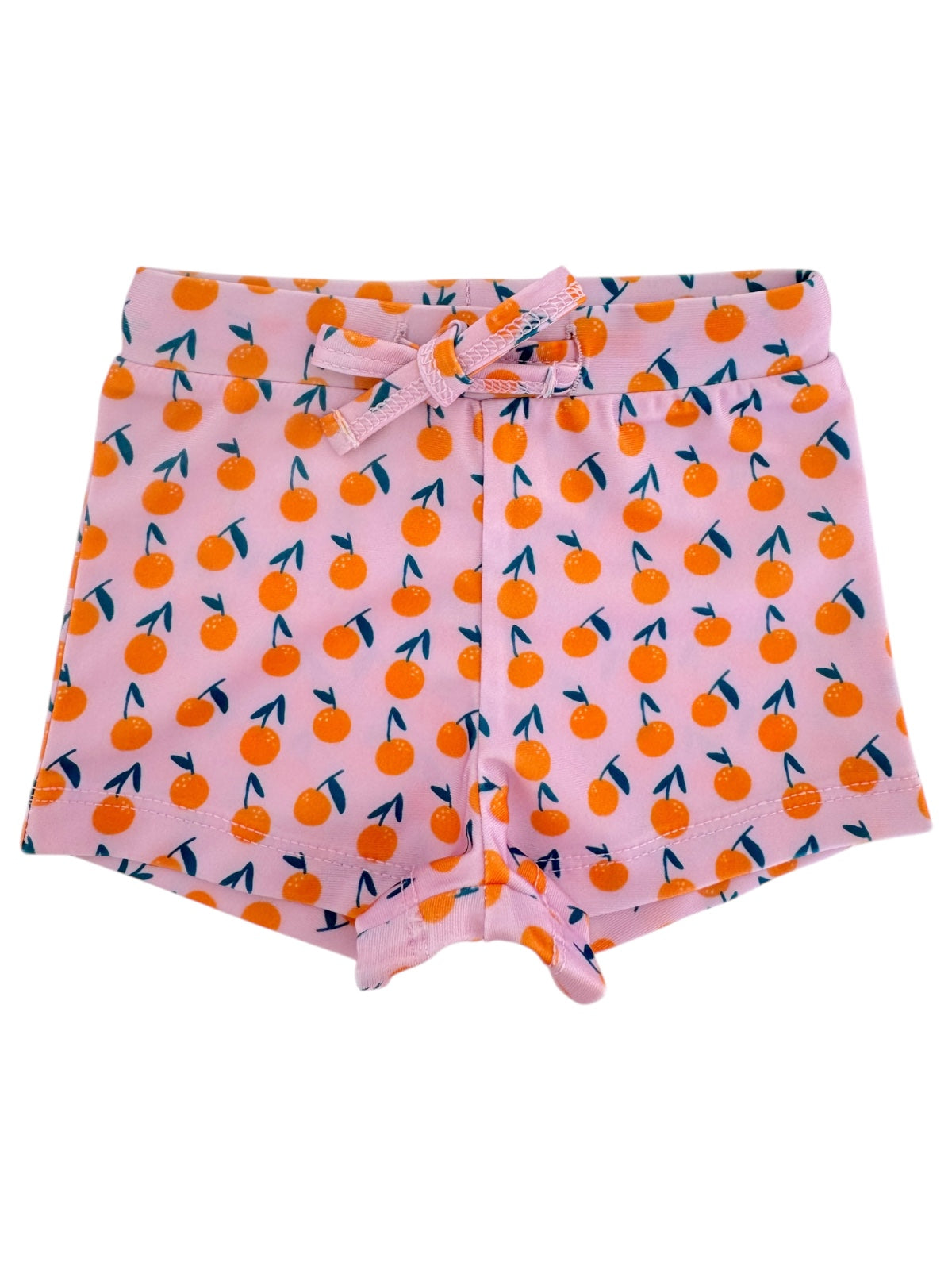Pink shorts with orange fruit pattern and blue leaves, featuring a tie waist. Ideal for casual summer wear.
