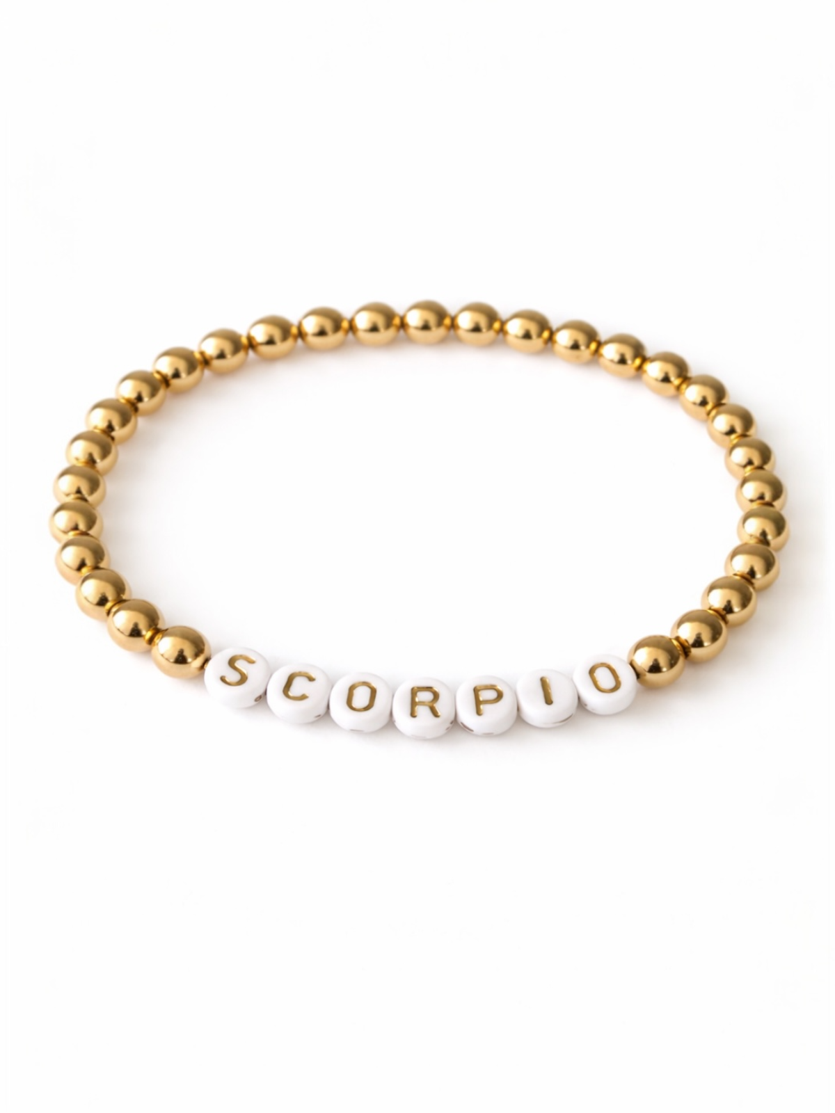 Gold and white bead bracelet with "SCORPIO" spelled out in letters.