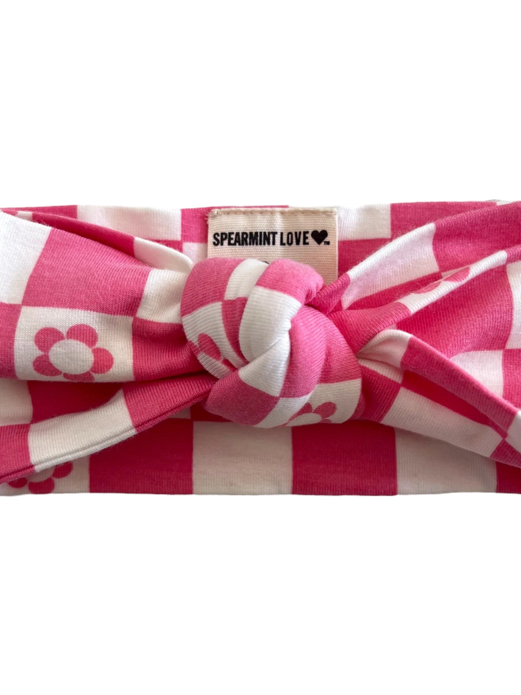 Pink and white checkered knot headband with flower design, labeled "SPEARMINT LOVE."