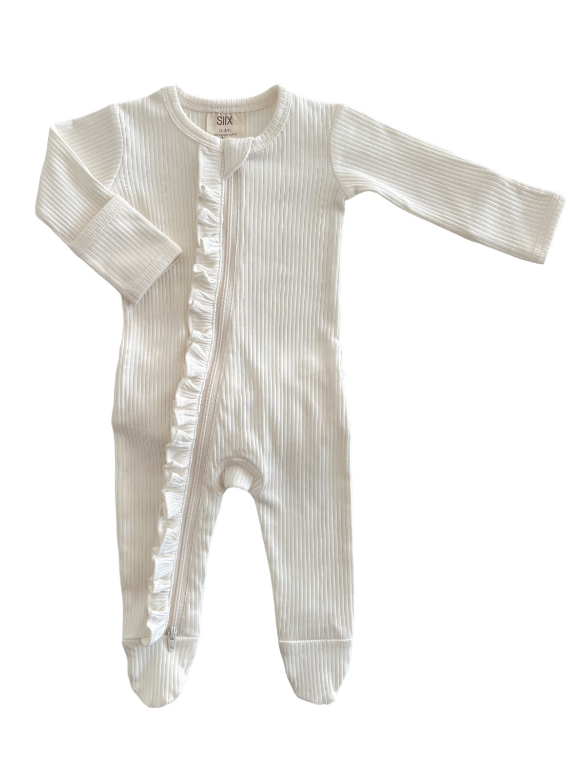 White baby onesie with ribbed texture and ruffle detail, featuring long sleeves and a zip closure.