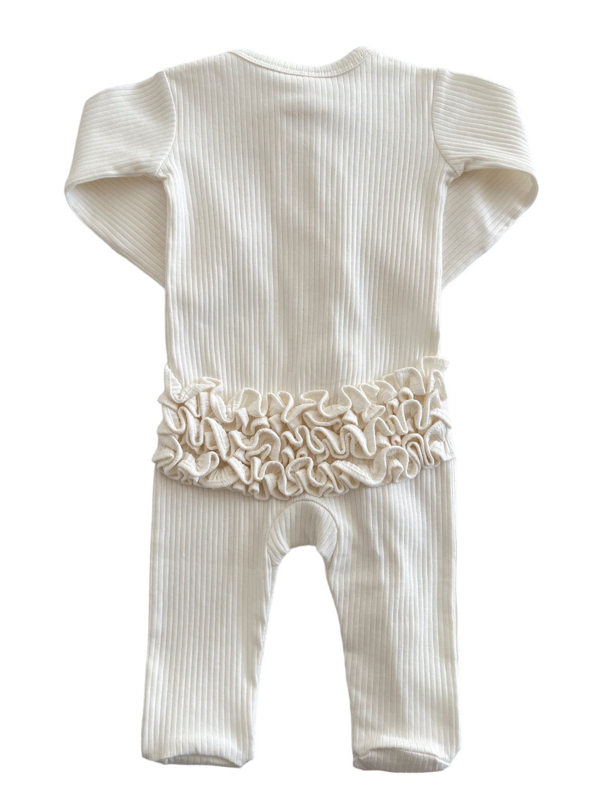 Cream-colored baby onesie with ribbed texture and ruffled detail at the waist, viewed from the back.