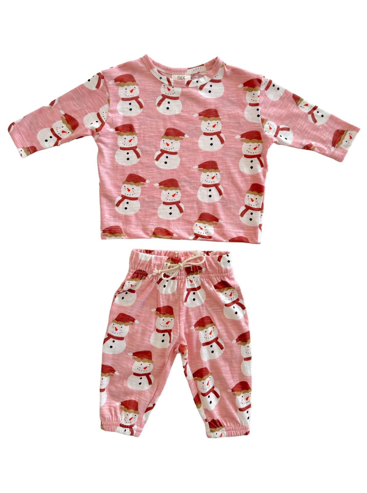 Pink toddler pajama set featuring cheerful snowmen with red hats and scarves. Ideal for winter sleepwear.