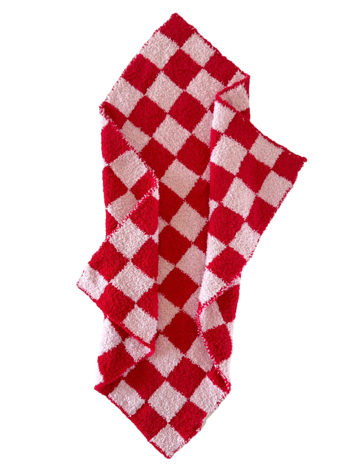 Red and white checkered kitchen towel folded and draped on a white background.