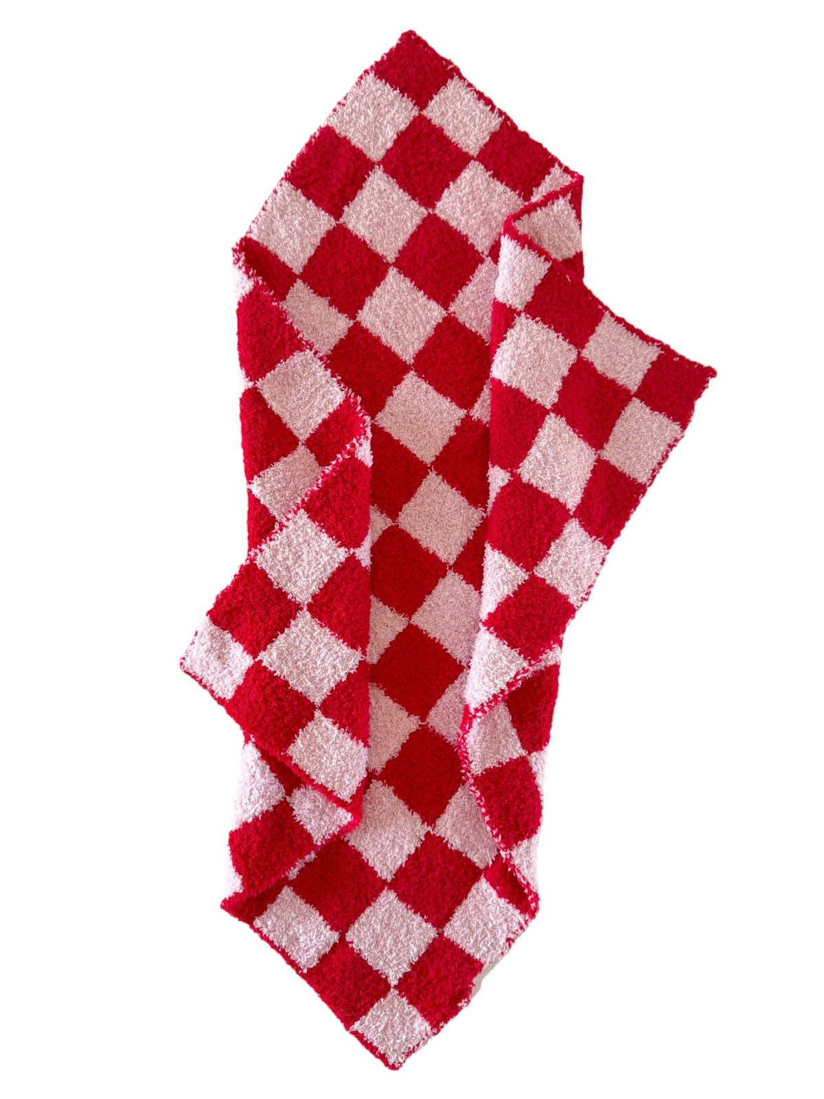 Red and white checkered kitchen towel folded and draped on a white background.