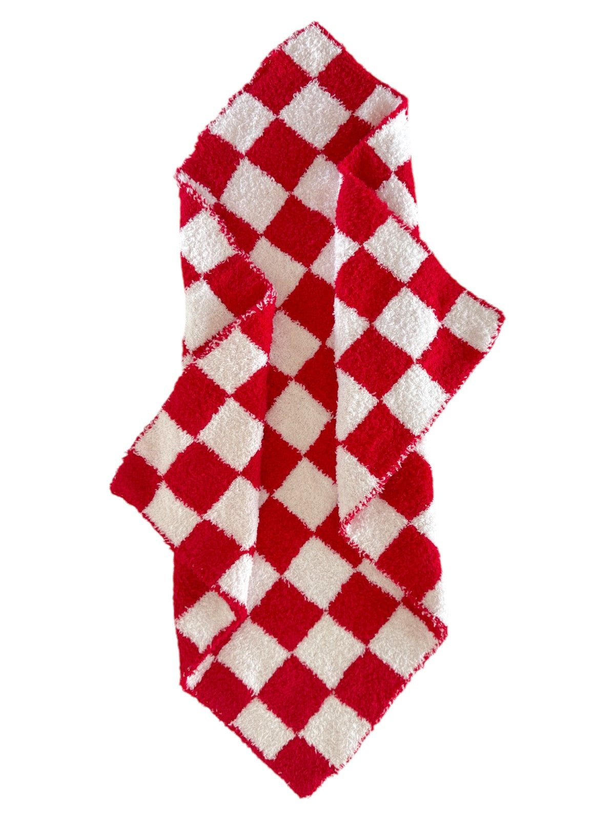 Red and white checkered towel draped stylishly, featuring a plush texture and a vibrant pattern.