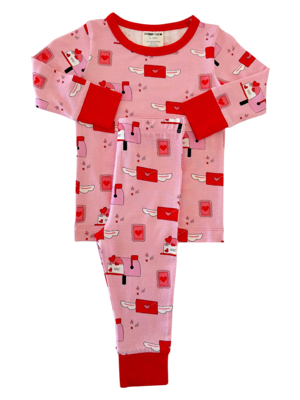 Pink pajama set with red accents featuring playful mailboxes and hearts pattern. Perfect for cozy nights.