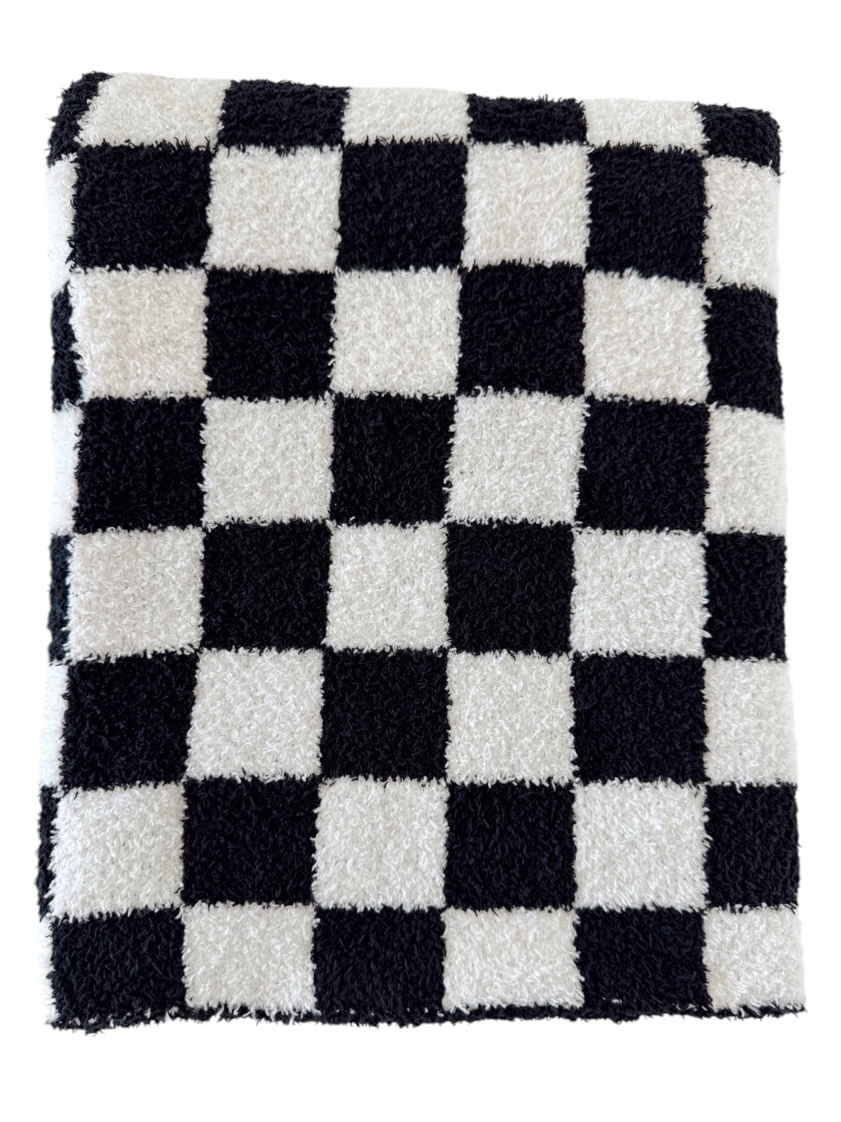 Black and white checkered plush towel folded neatly.