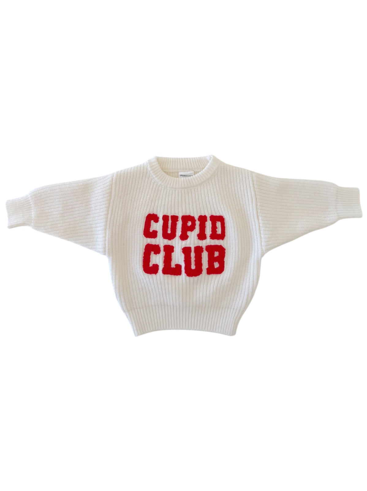 White sweater with red "Cupid Club" lettering on the front, featuring a cozy oversized design.