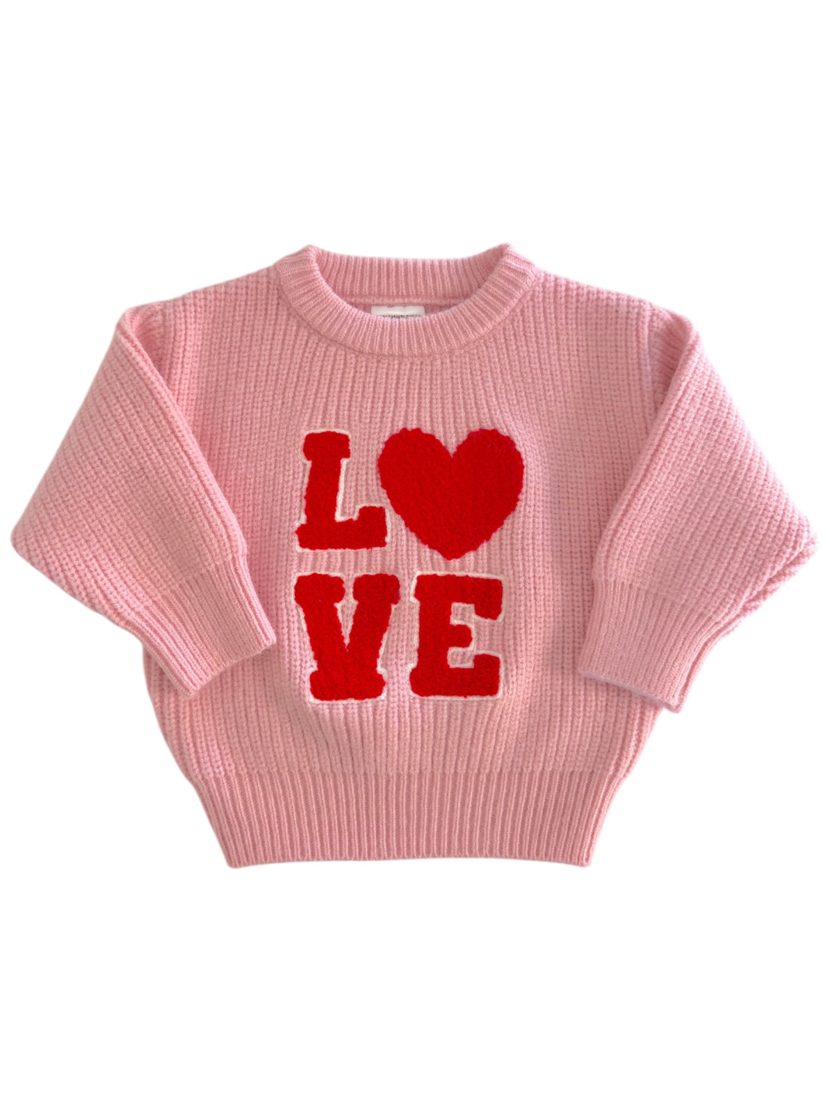Pink sweater with red "LOVE" text and a heart detail, perfect for a casual, stylish look.