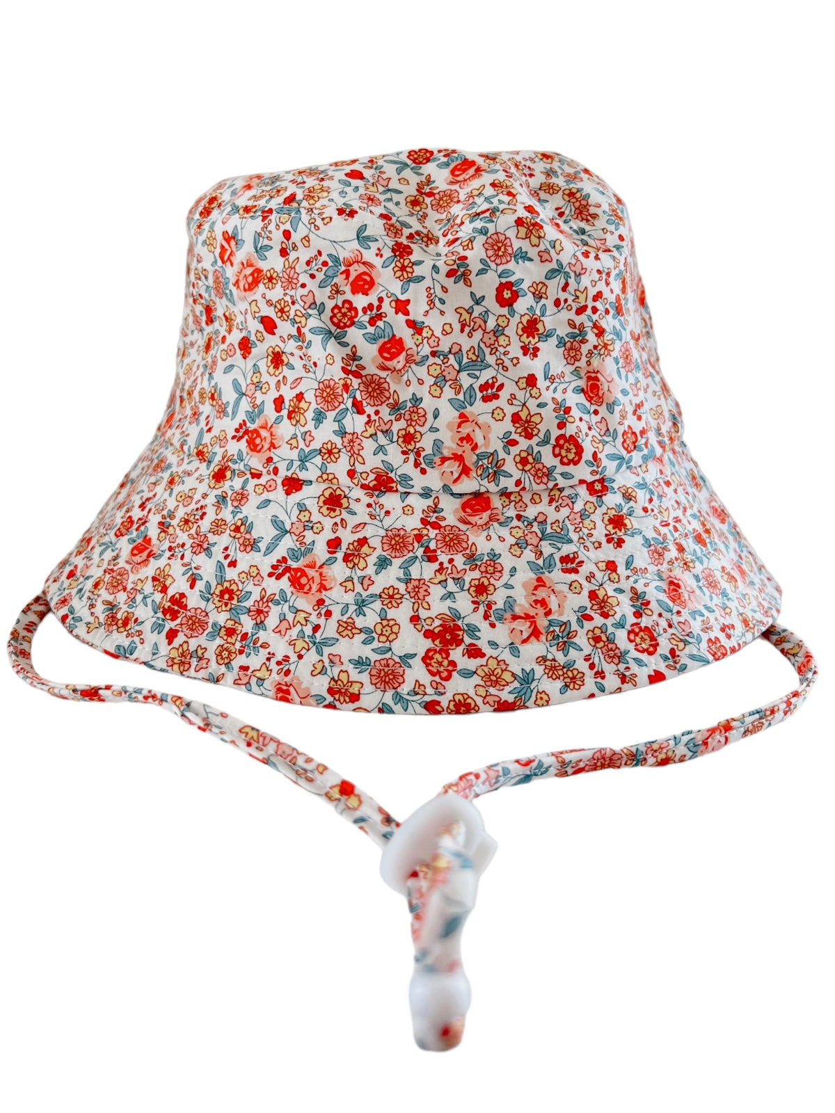 Floral bucket hat with a white background, featuring red and blue flowers, and an adjustable chin strap.