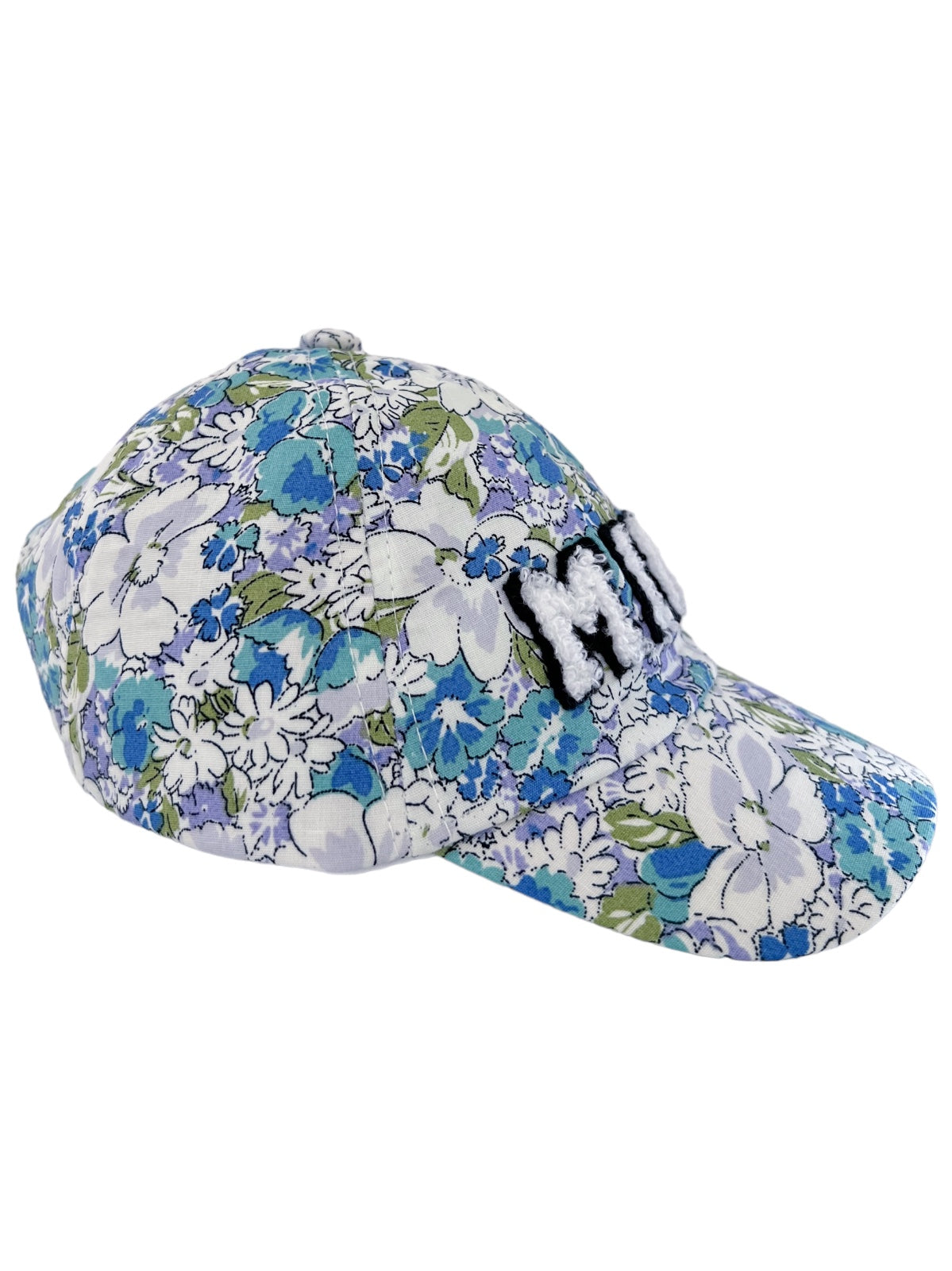 Floral-patterned cap featuring blue and white flowers with a black embroidered text on the front.