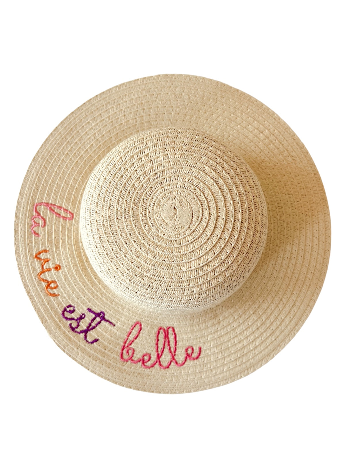 Wide-brimmed straw hat with the phrase "la vie est belle" embroidered in colorful letters.