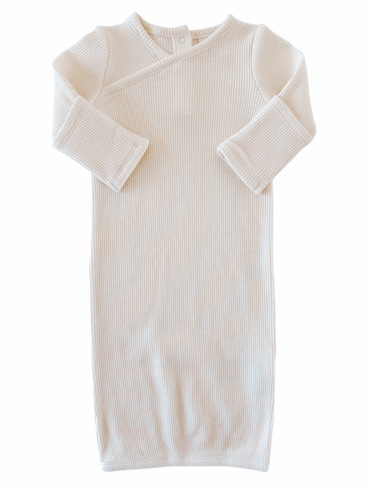 Cream-colored ribbed baby gown with long sleeves and a wrap design, perfect for infants.