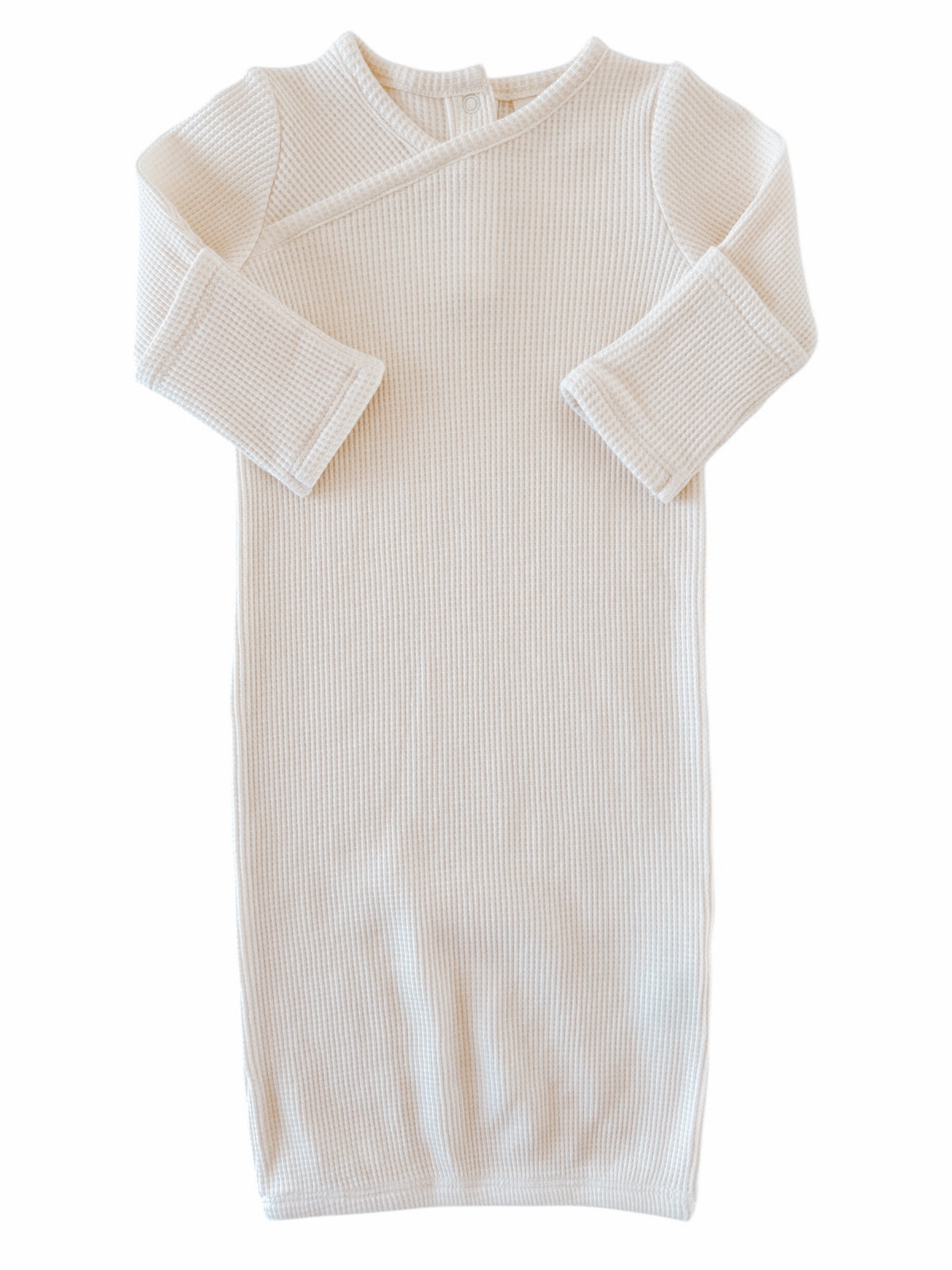 Cream-colored ribbed baby gown with long sleeves and a wrap design, perfect for infants.