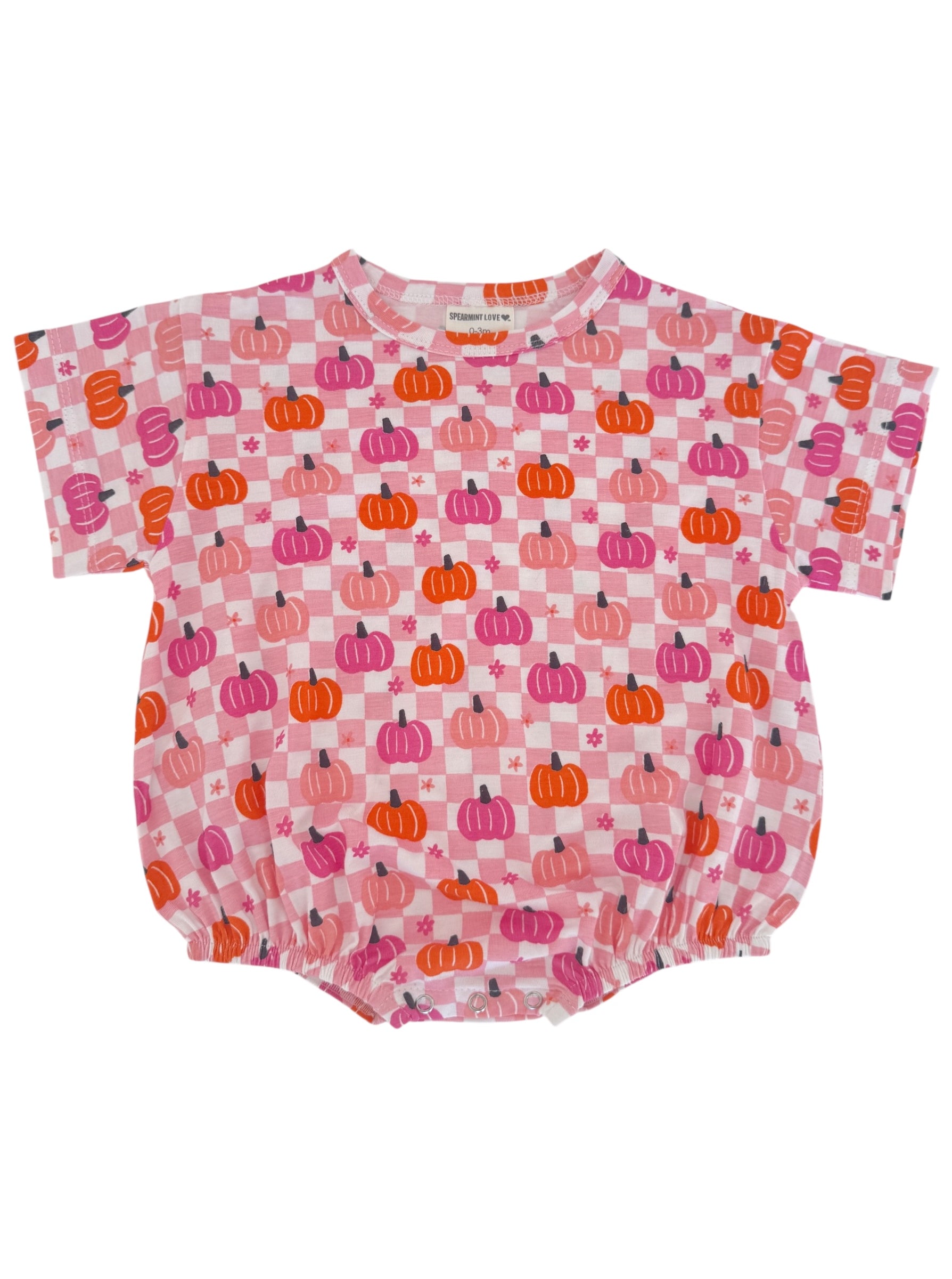 Pink romper with pumpkin print in shades of orange and purple, featuring short sleeves and elastic hem.