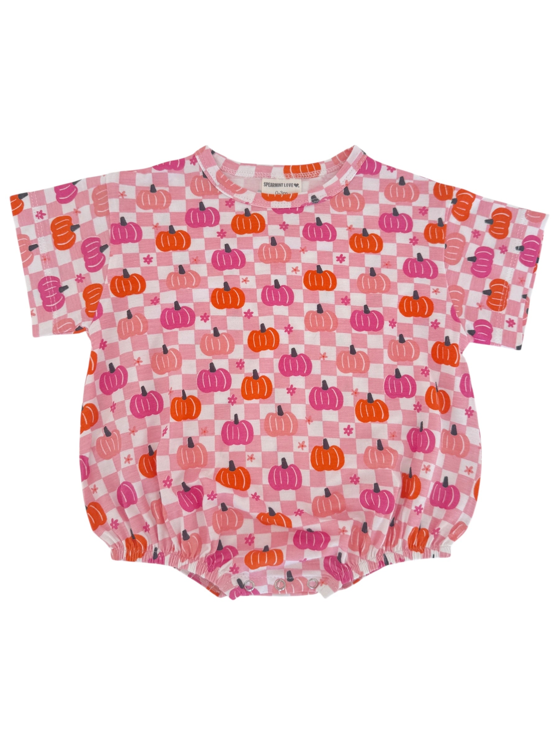 Pink romper with pumpkin print in shades of orange and purple, featuring short sleeves and elastic hem.