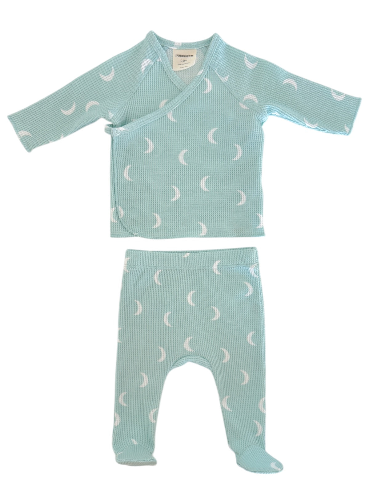 Light blue baby clothing set with moon patterns; includes a wrap top and matching pants with footies.