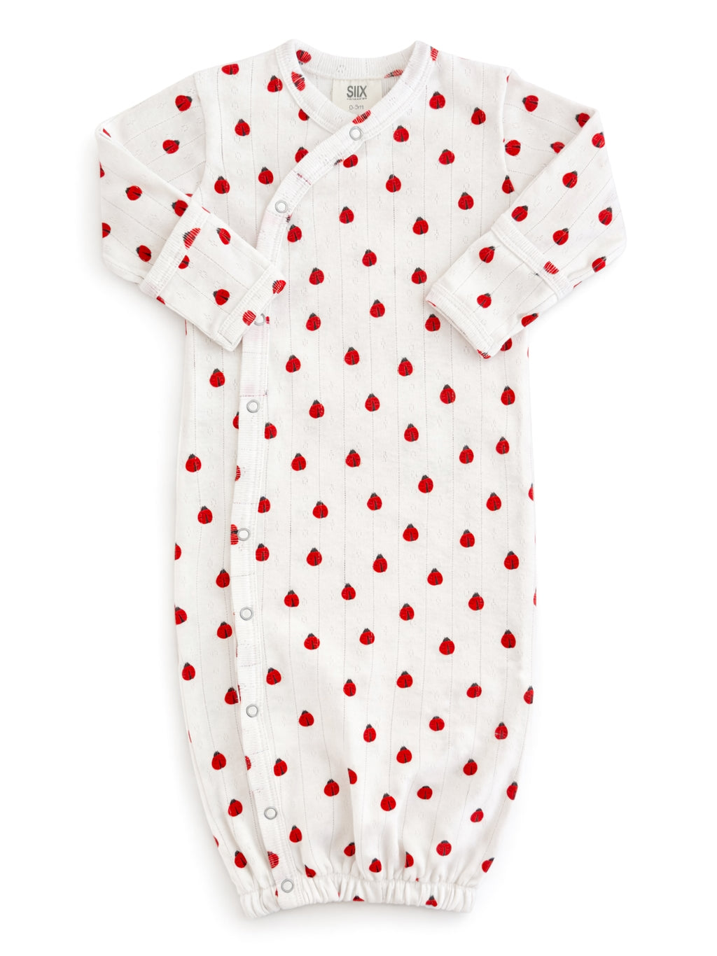 White baby sleep sack with red heart print and button closure, featuring long sleeves and gathered bottom.