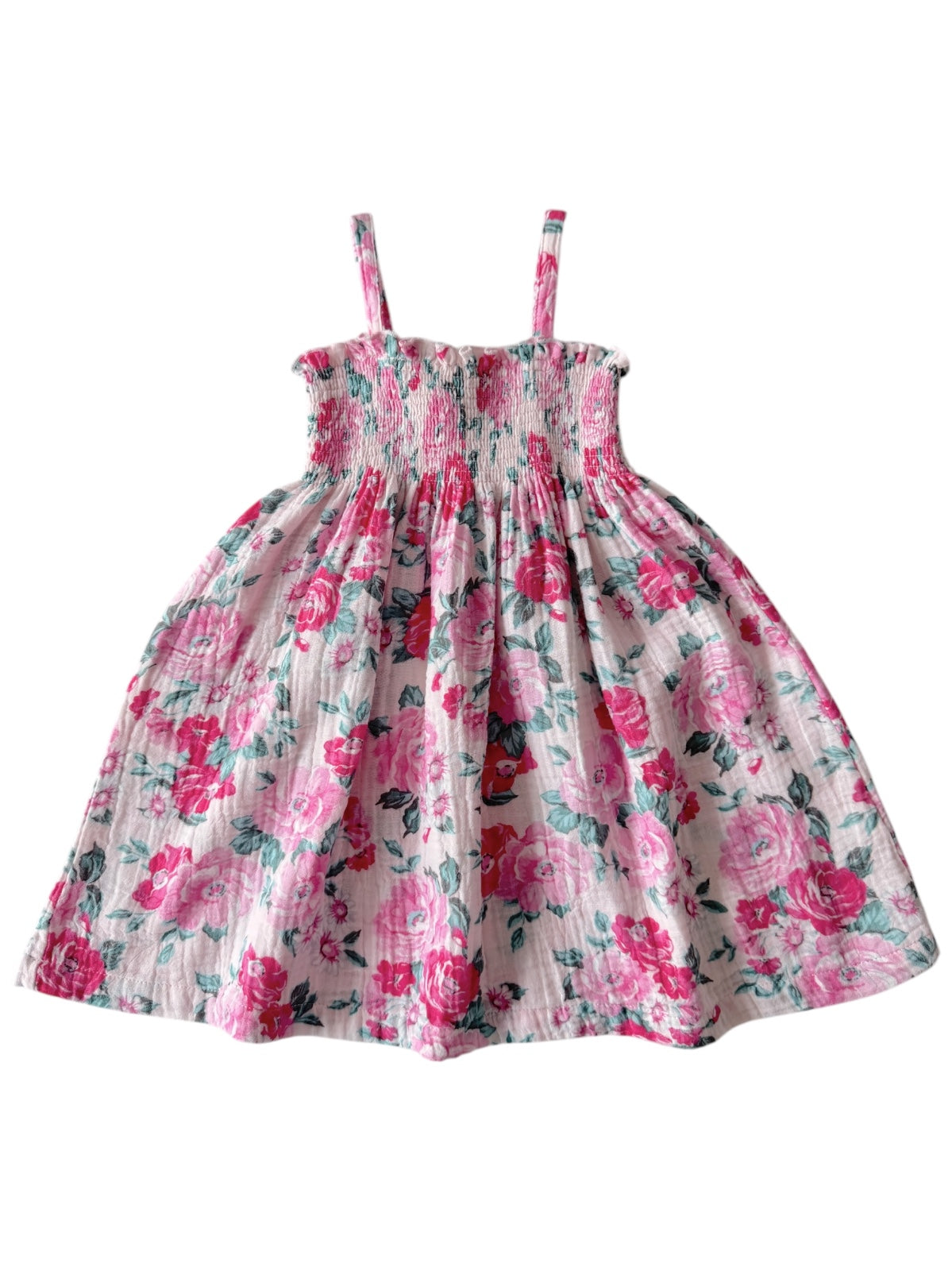 Floral smocked sundress with thin straps, featuring pink roses on a light background.
