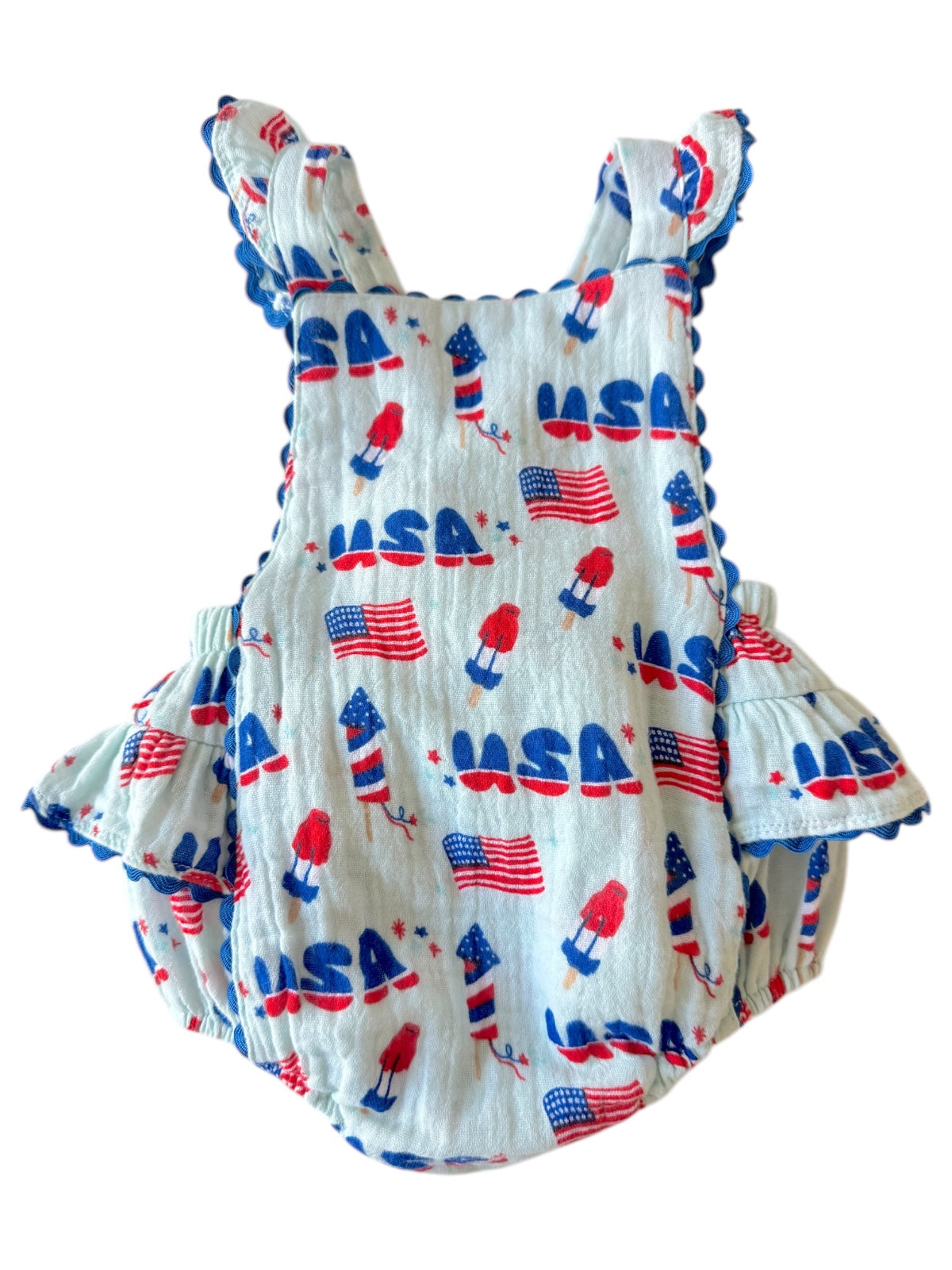 Toddler romper with USA-themed print, featuring rockets and flags in red, white, and blue colors.