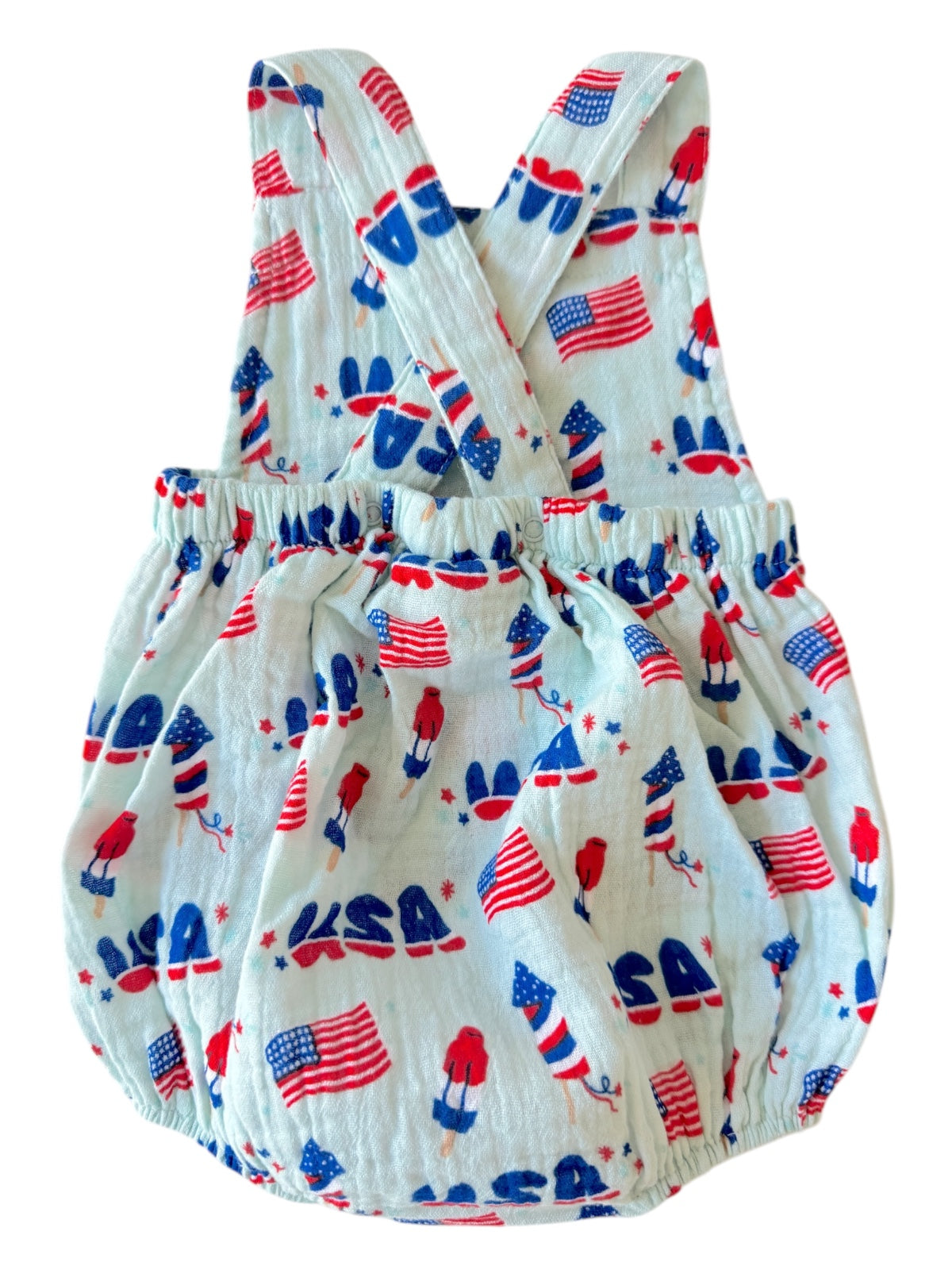 Children's romper with red, white, and blue patriotic print featuring USA flags and gnomes.