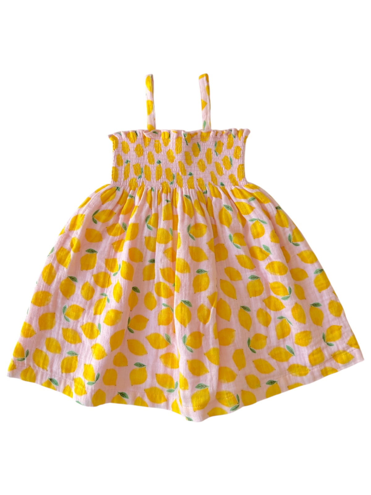 Lemon-patterned dress in soft pink, featuring thin straps and a smocked bodice for a playful summer look.