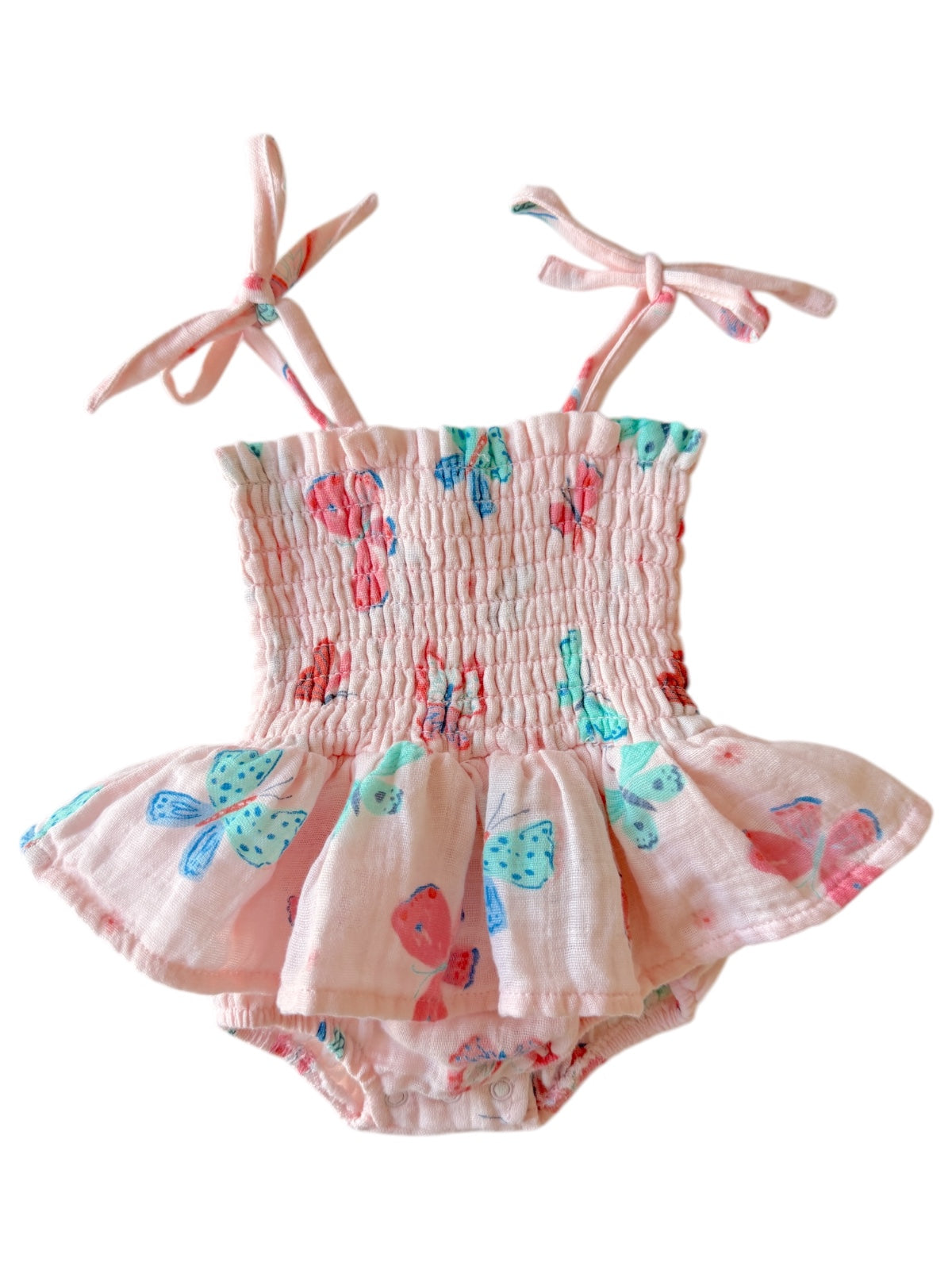 Pink butterfly print baby swimsuit with smocked bodice and ties. Flared skirt design and snap closure at the bottom.