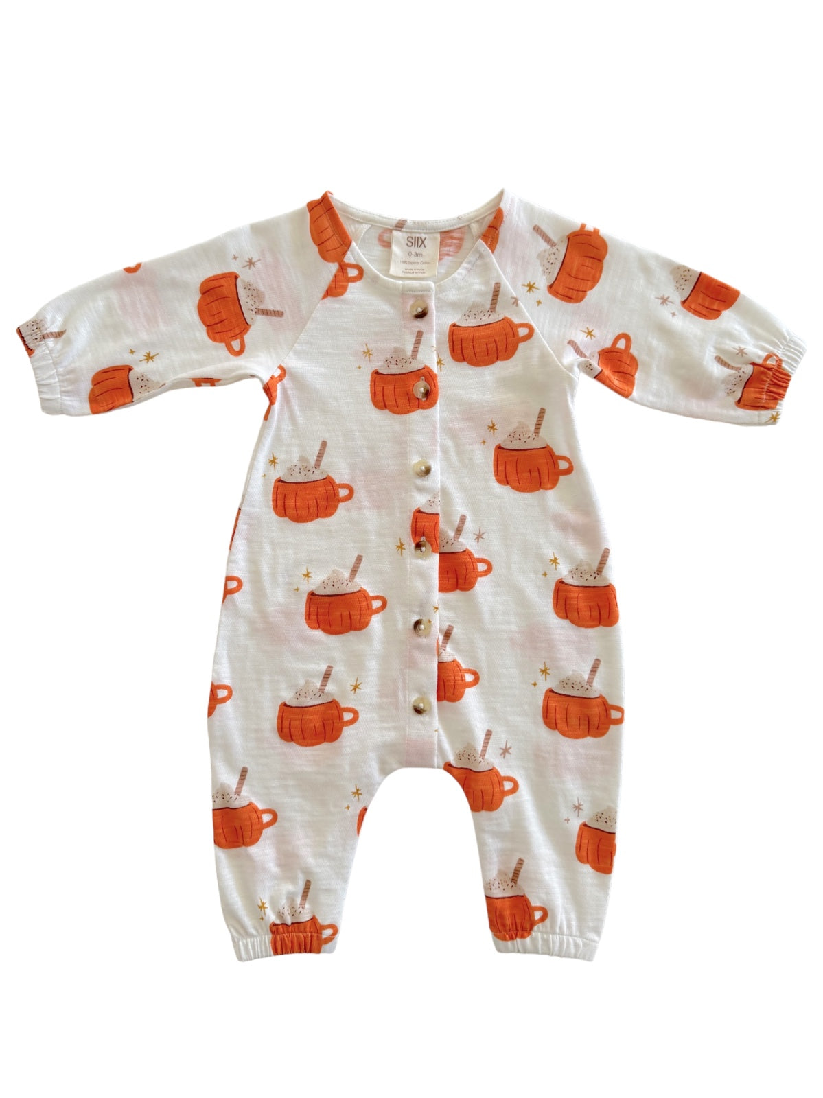 White infant onesie with orange mugs and sprinkles pattern, featuring buttons down the front and long sleeves.