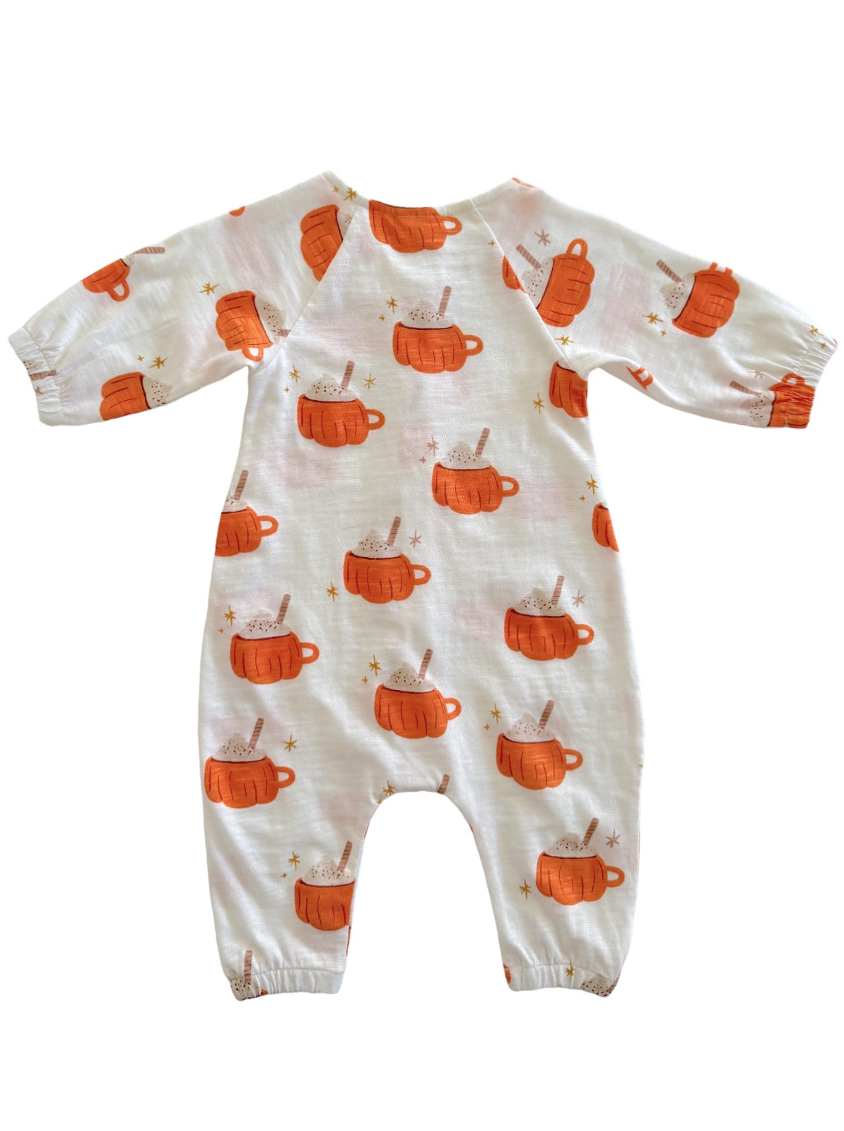 Cute baby onesie covered in orange mugs with treats and stars against a white background. Ideal for cozy wear.