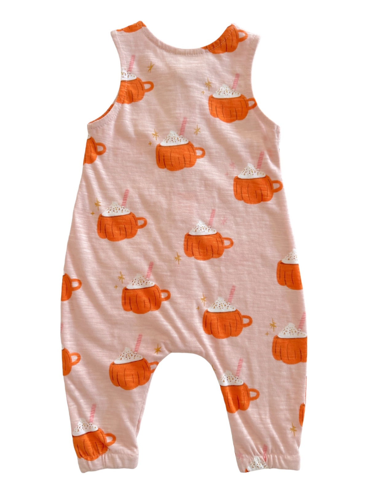 Pink romper with orange pumpkin mugs and white whipped cream design, ideal for cozy fall wear.