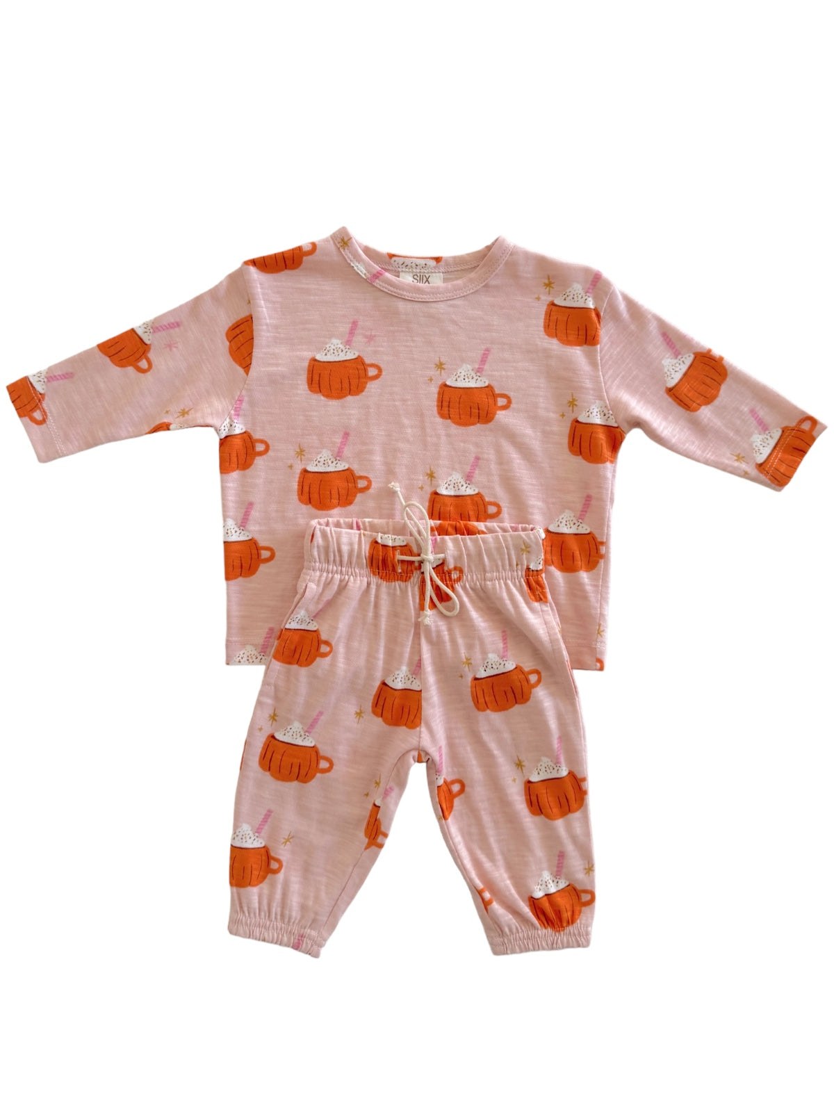 Kids' pajama set in pink with cute hot cup illustrations, featuring a long-sleeve top and elastic waist pants.