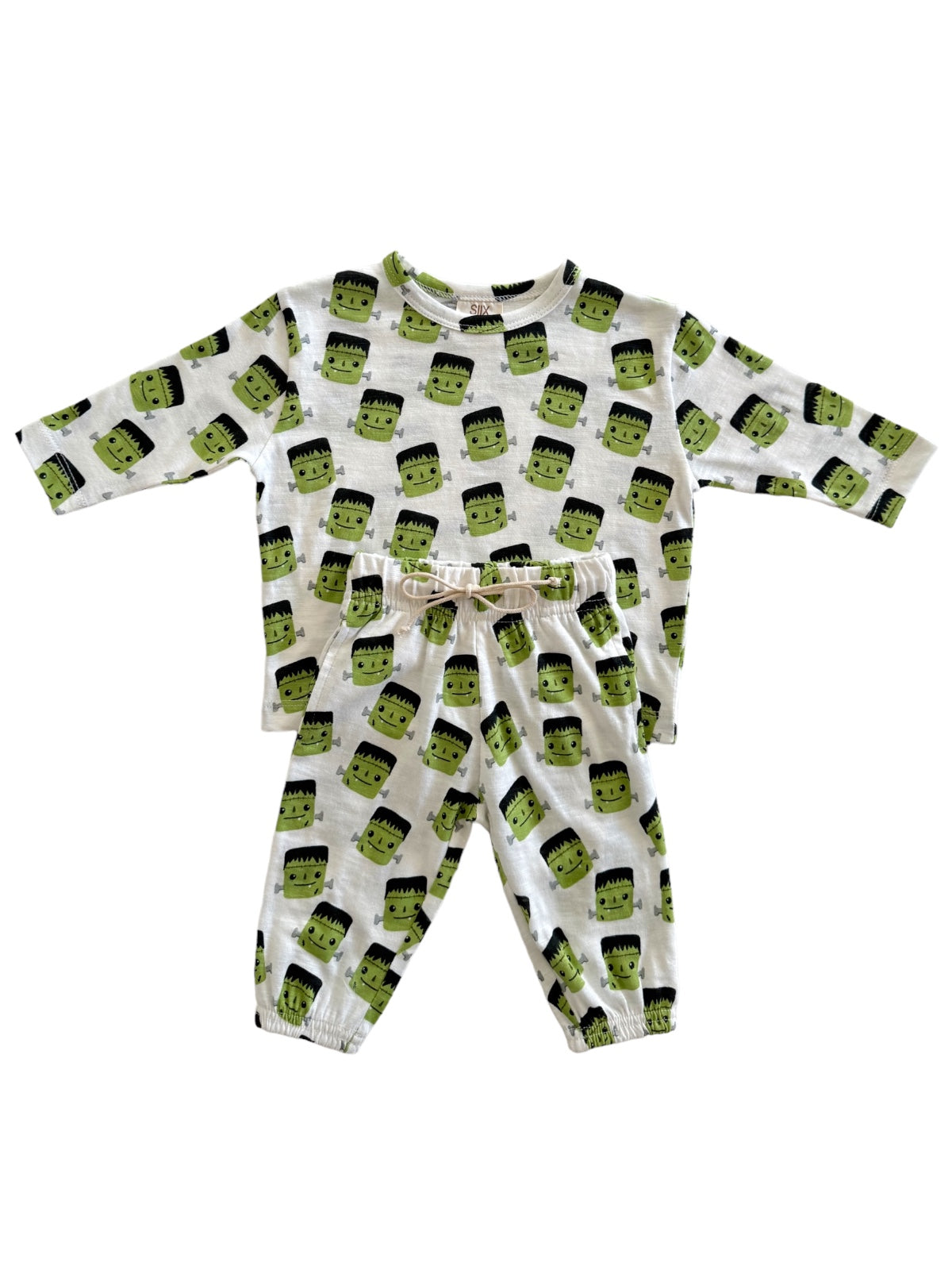 Frankenstein-themed pajama set featuring a long-sleeve top and elastic waistband pants, both with playful print.