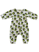 White baby onesie with green Frankenstein faces and black hair, featuring snap buttons down the front and elastic cuffs.