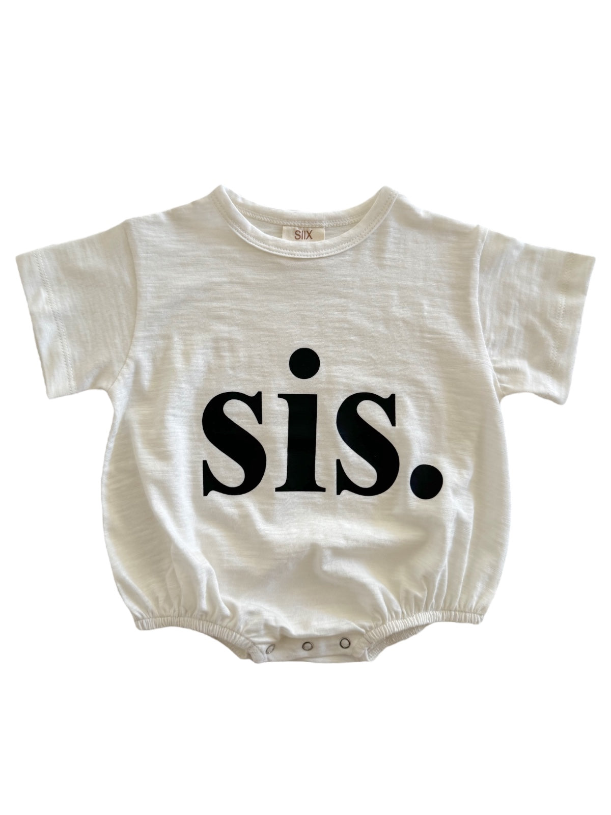 White onesie with black text reading "sis." on the front, featuring short sleeves and a snap closure.