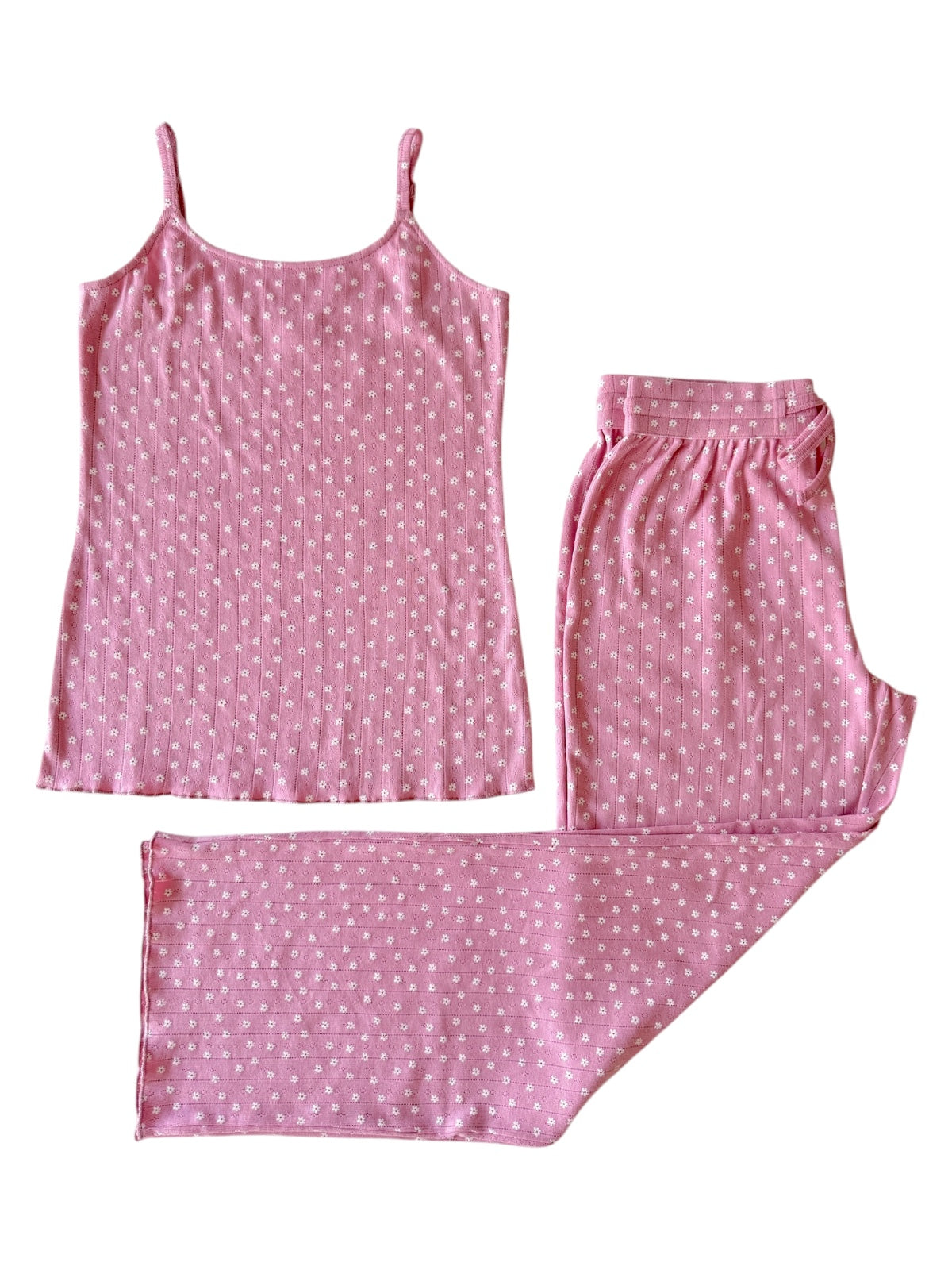 Pink pajama set featuring a tank top and long pants with a floral pattern on a white background.