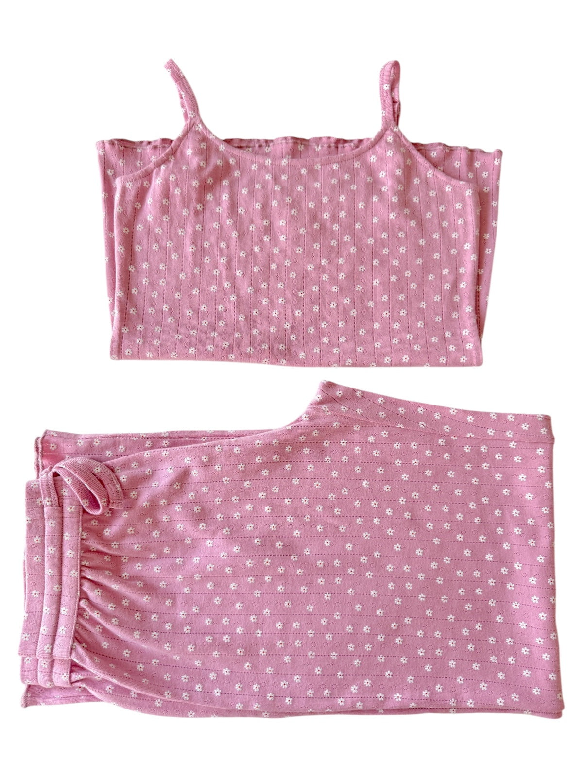 Pink floral patterned tank top and shorts set laid flat on a white background.