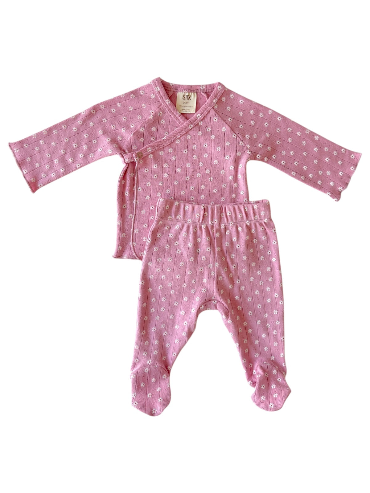 Pink baby outfit featuring a long-sleeve wrap top and matching pants with white floral patterns.