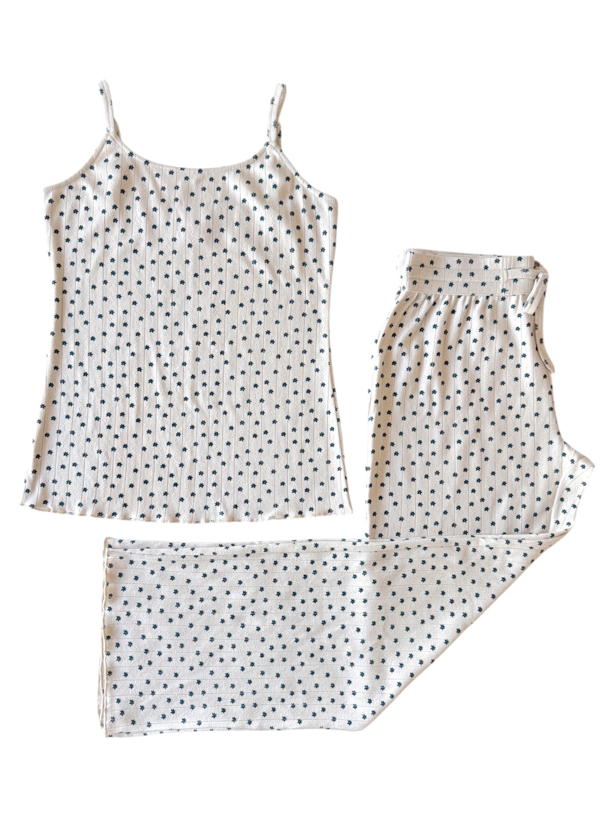 White tank top and matching pants with navy blue star print, laid flat on a white background.