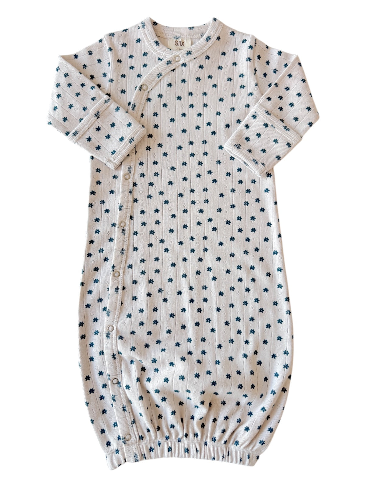 Light cream baby gown with navy floral pattern and buttons, perfect for comfortable sleeping.