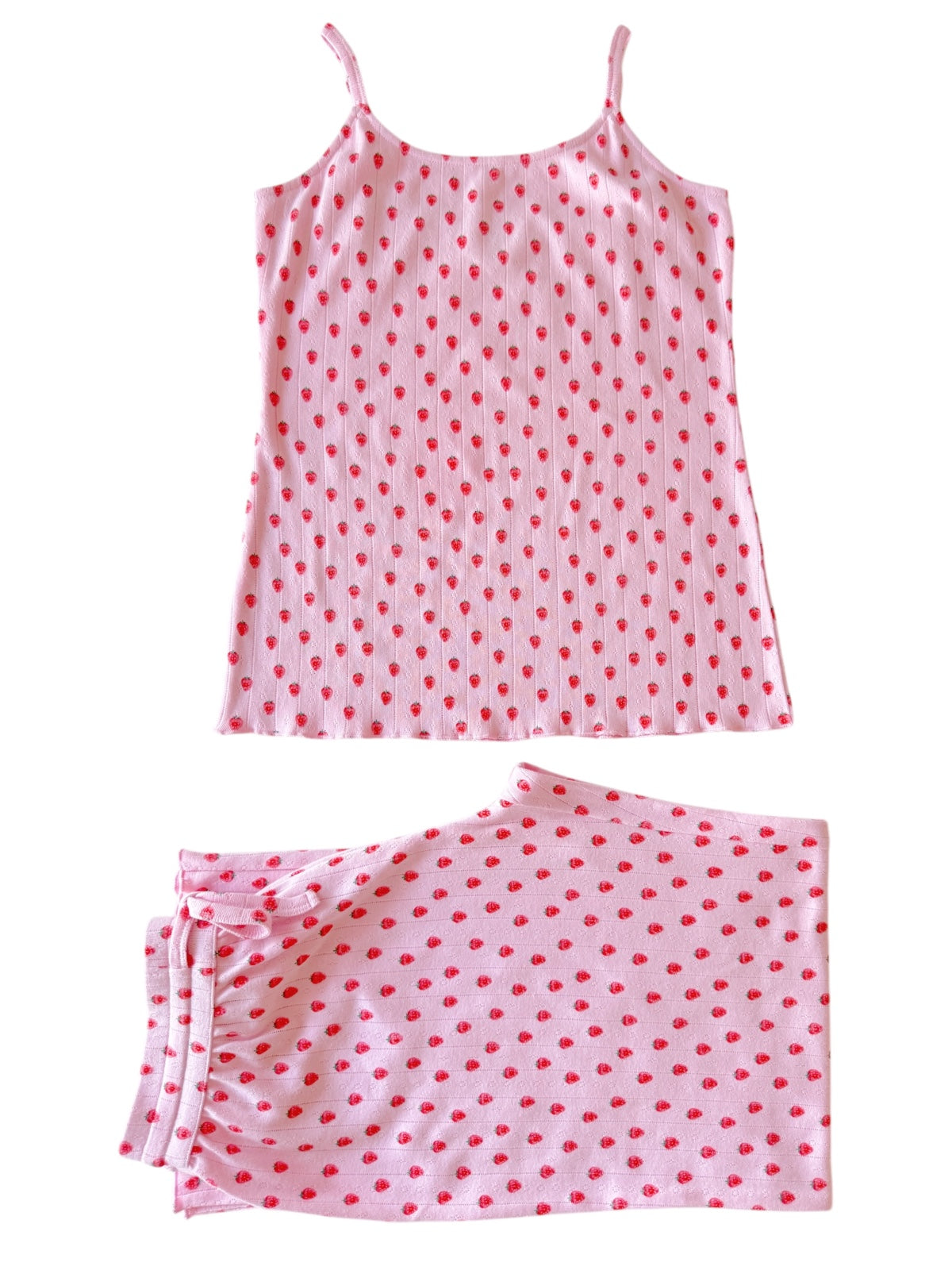 Pink pajama set with red polka dots, featuring a spaghetti strap top and matching pants.