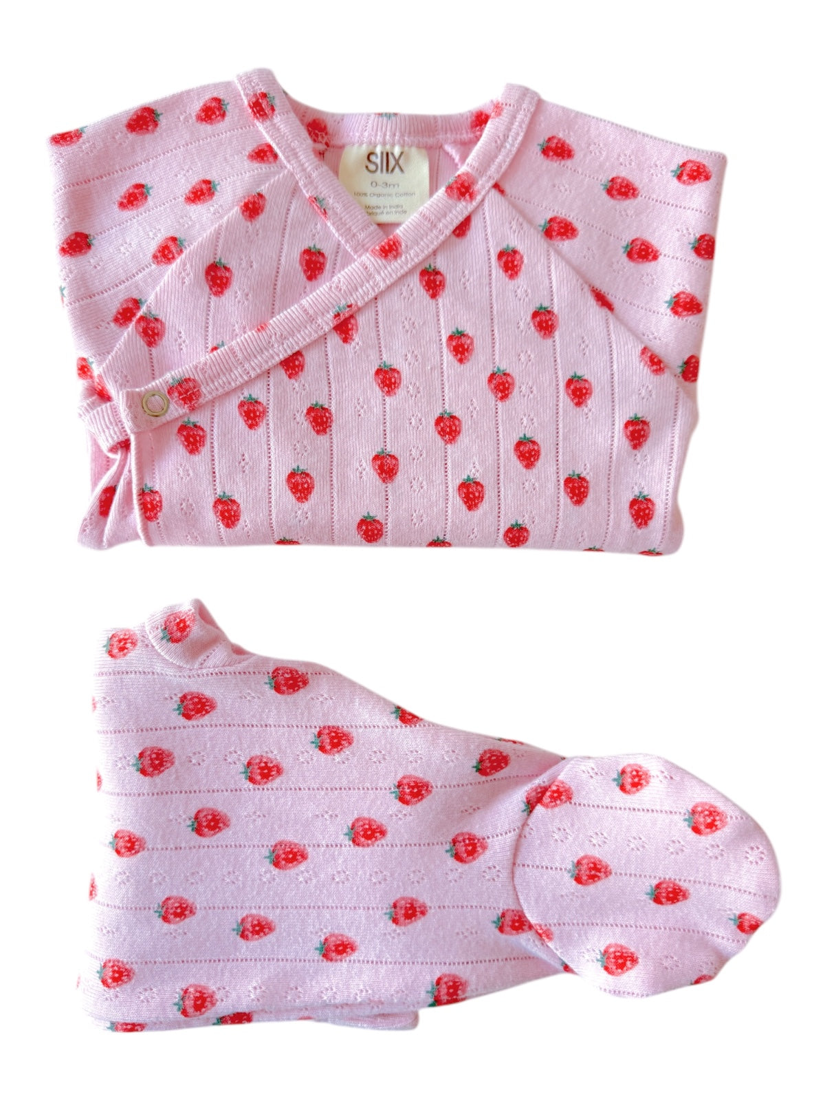 Pink baby outfit with strawberry print, including a wrap top and hat, ideal for infants 0-3 months.
