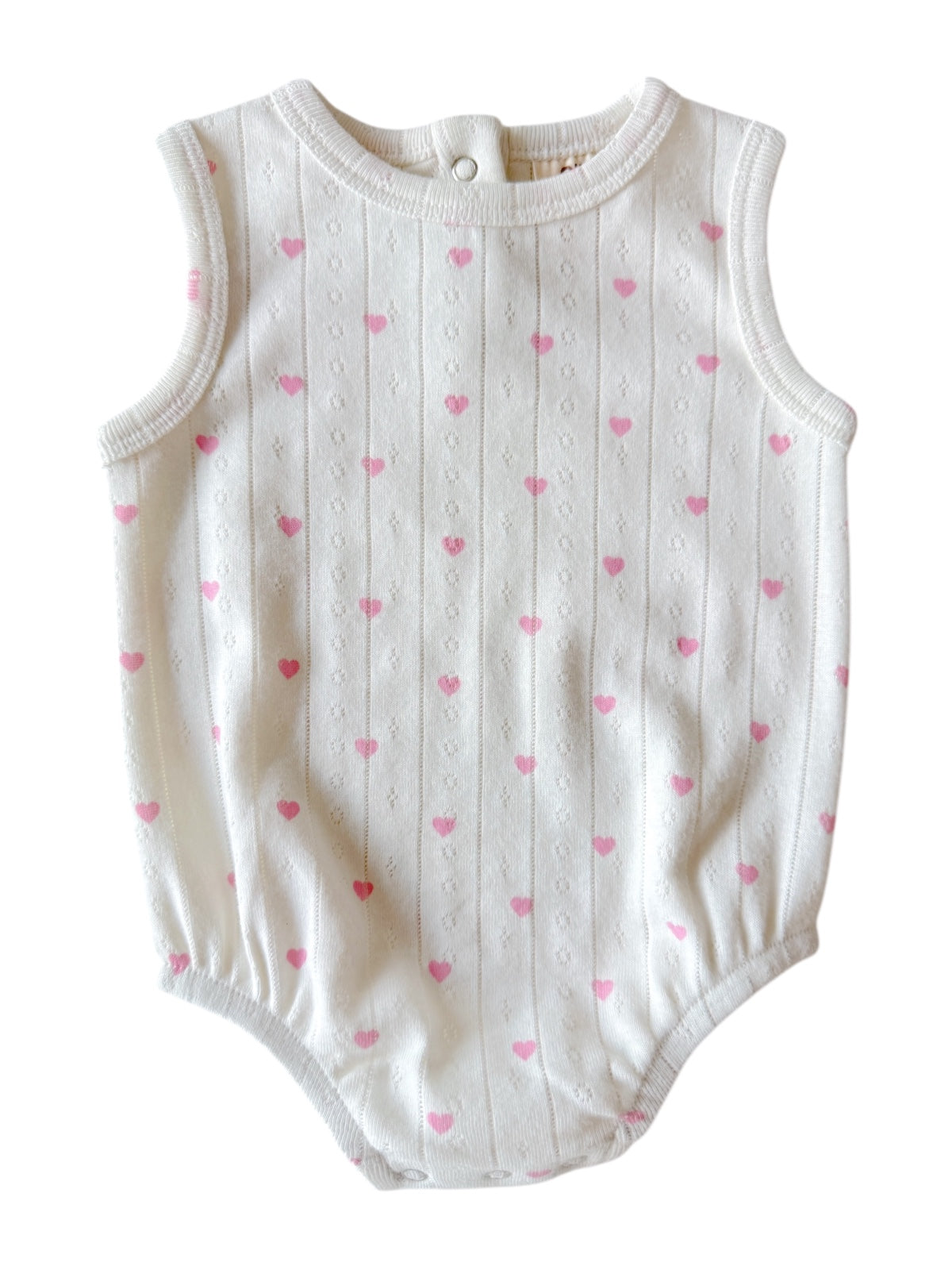 White baby onesie with small pink hearts and horizontal stripes, sleeveless, with snap closure at the back.