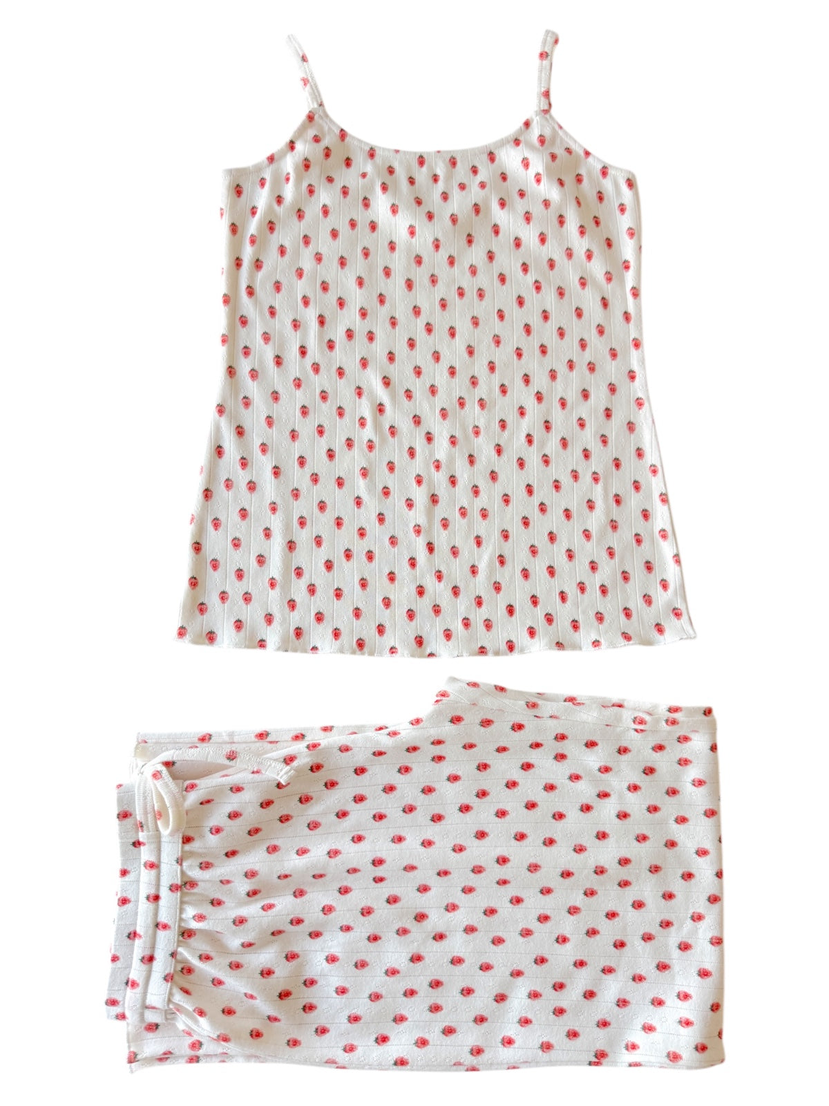 White tank top and matching bottoms with red polka dots, laid flat on a white background.