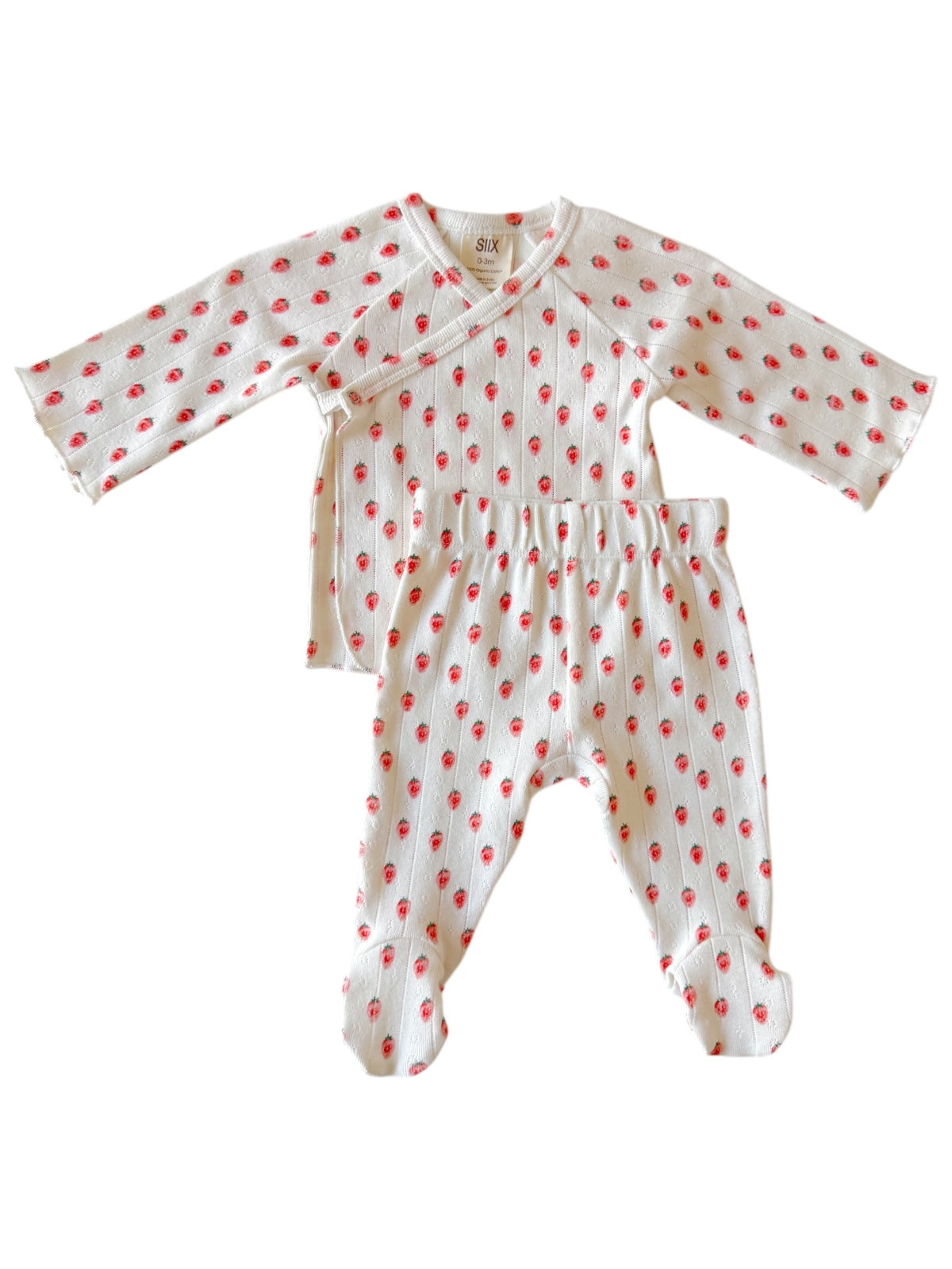 Baby outfit with long-sleeve top and footed pants, featuring a white background and red floral print.