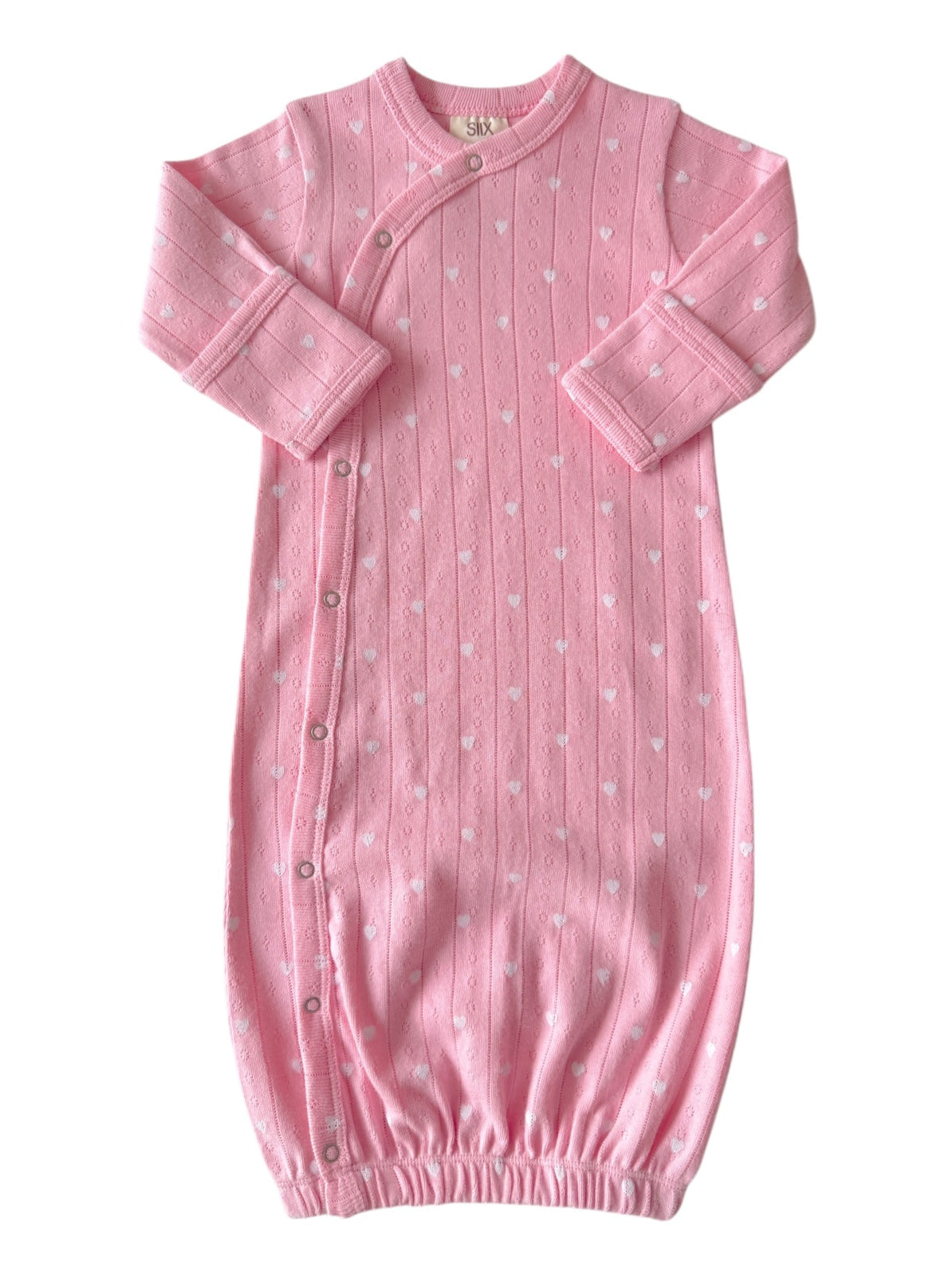 Pink baby sleep gown with white heart patterns, featuring long sleeves and button closures along the side.
