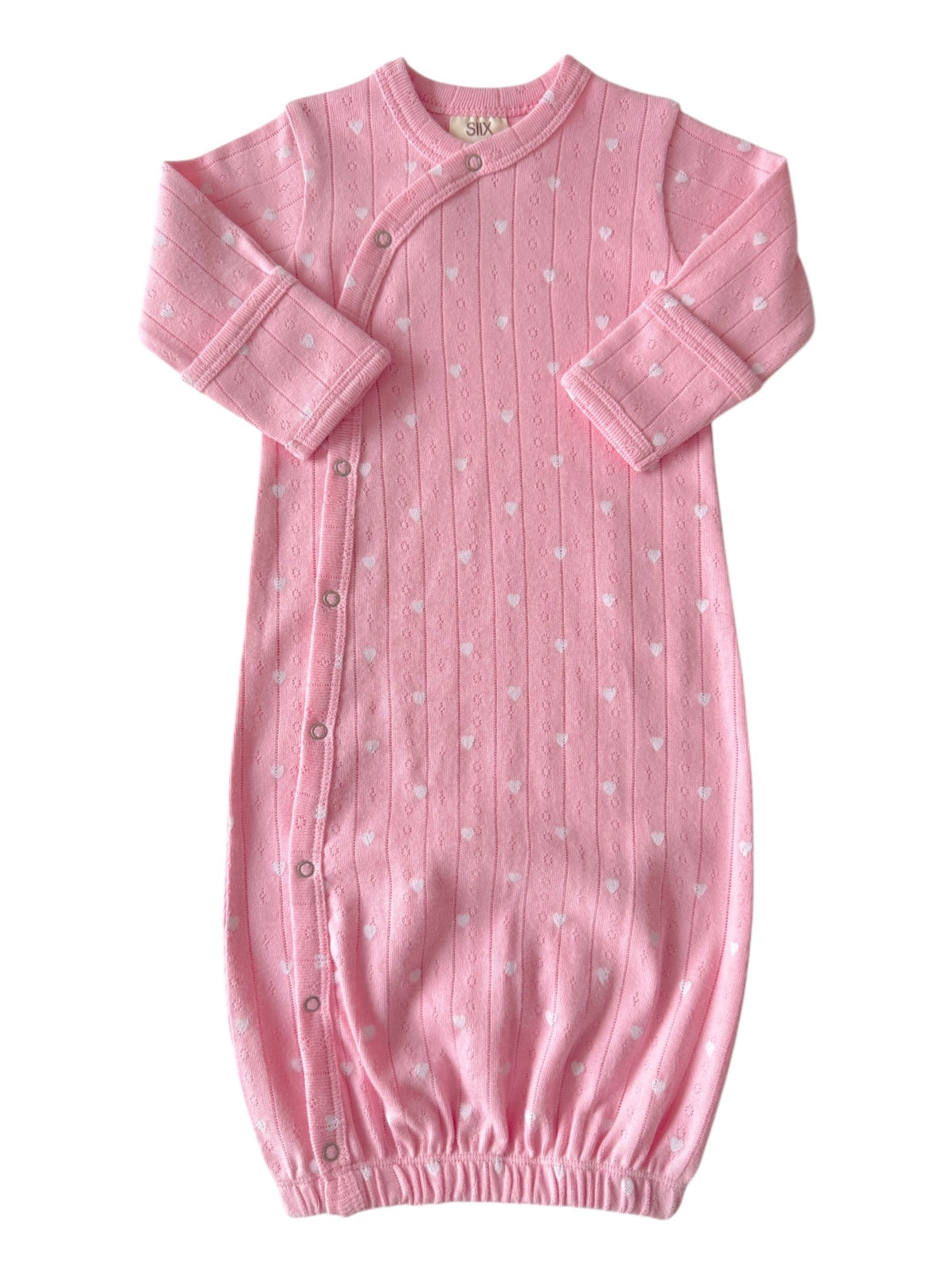 Pink baby sleep gown with white heart patterns, featuring long sleeves and button closures along the side.