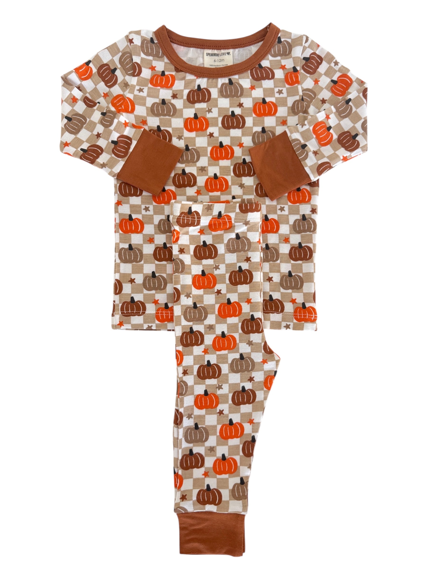 Pumpkin-patterned children's pajamas in earthy tones with long sleeves and pants. Perfect for cozy, festive wear.