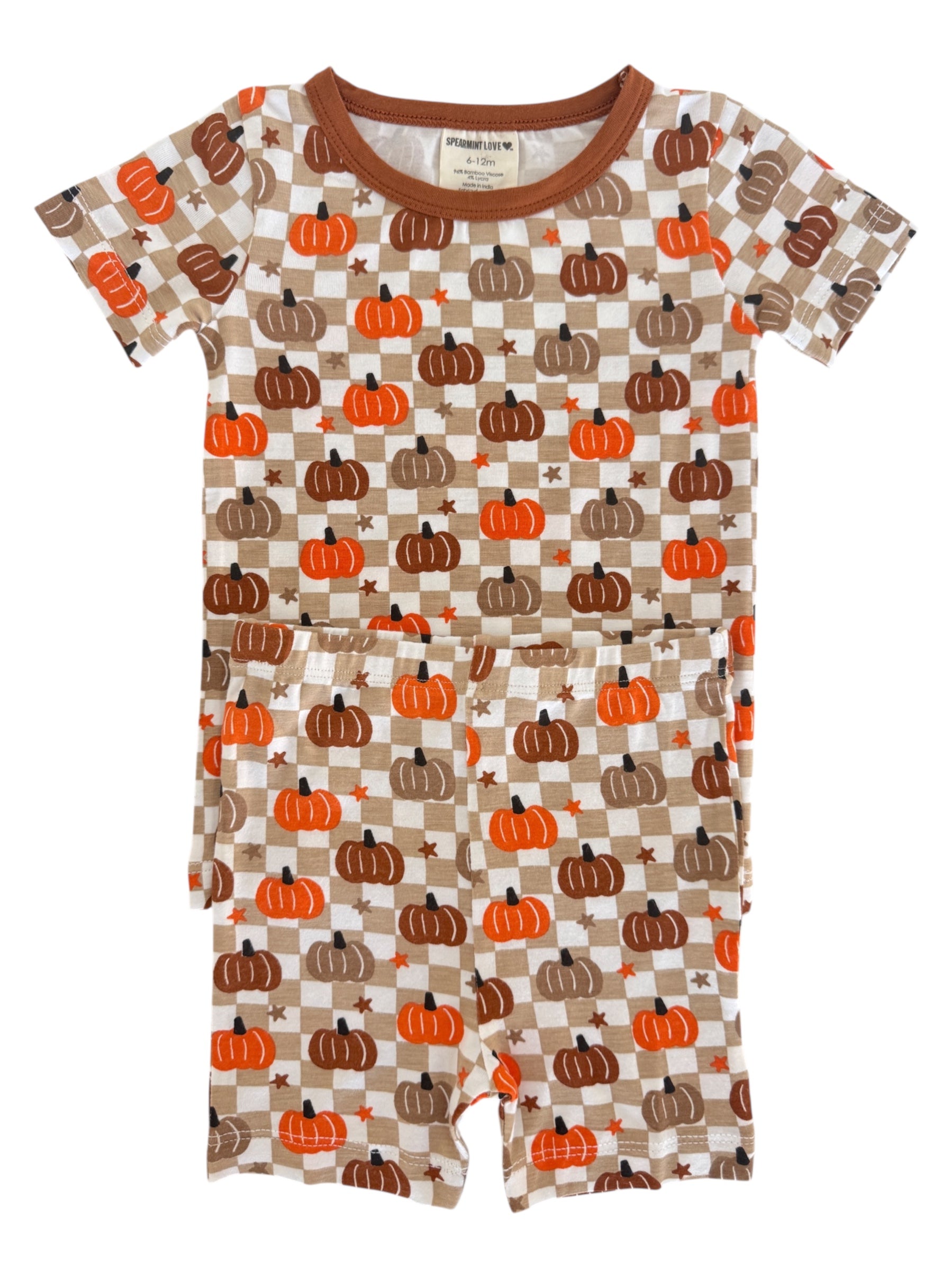 Brown and orange pumpkin-patterned children's pajama set on a white background.