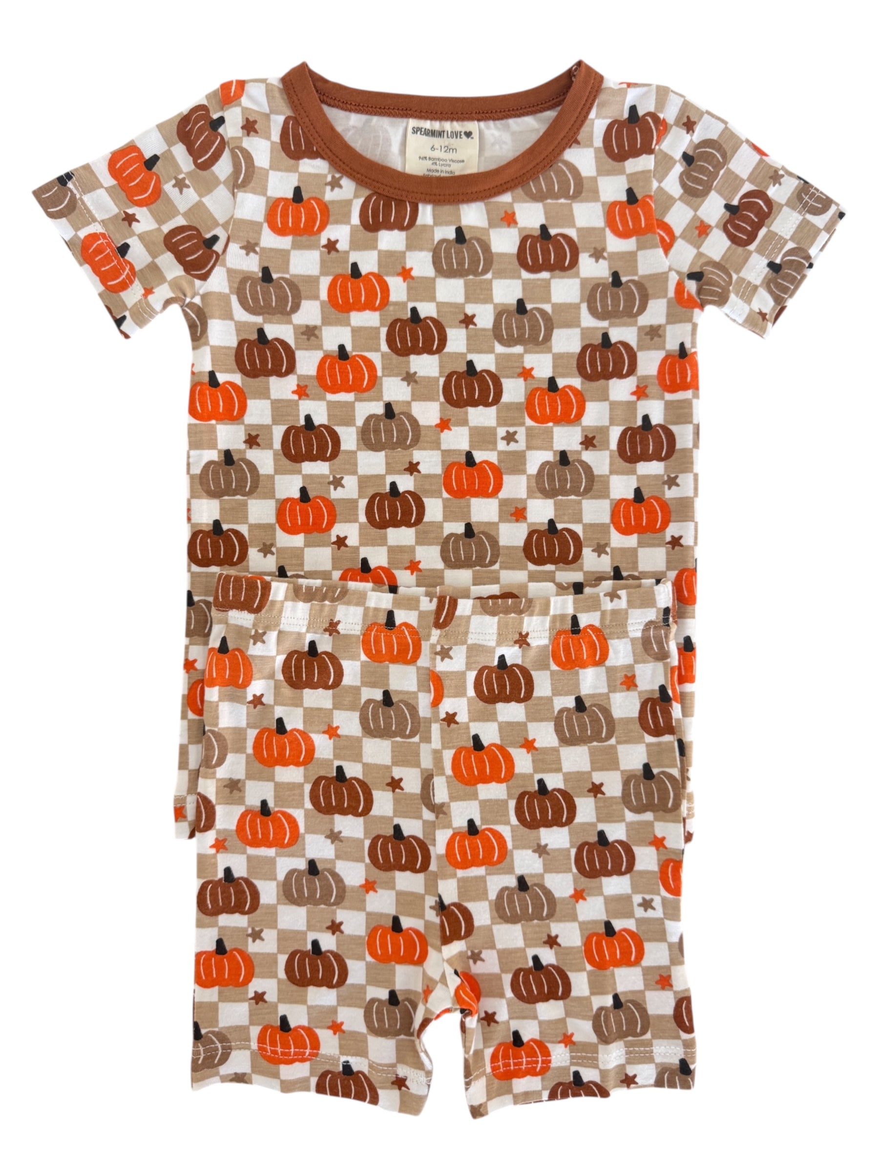 Brown and orange pumpkin-patterned children's pajama set on a white background.