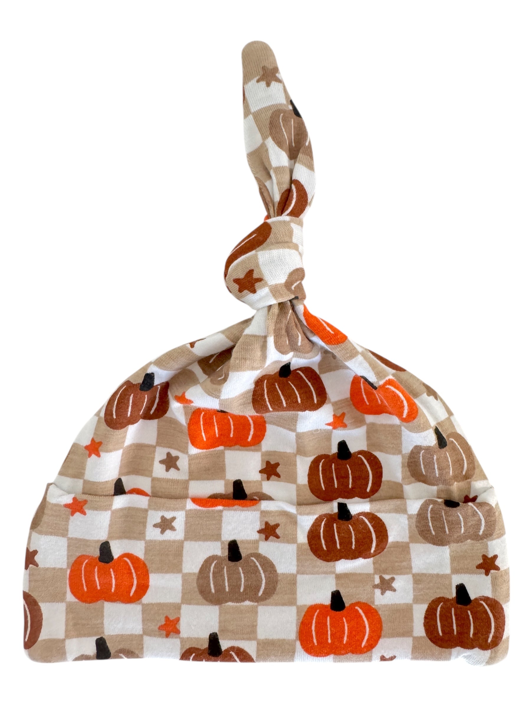 Knotted baby hat featuring a pumpkin pattern on a checkered background in autumn colors.